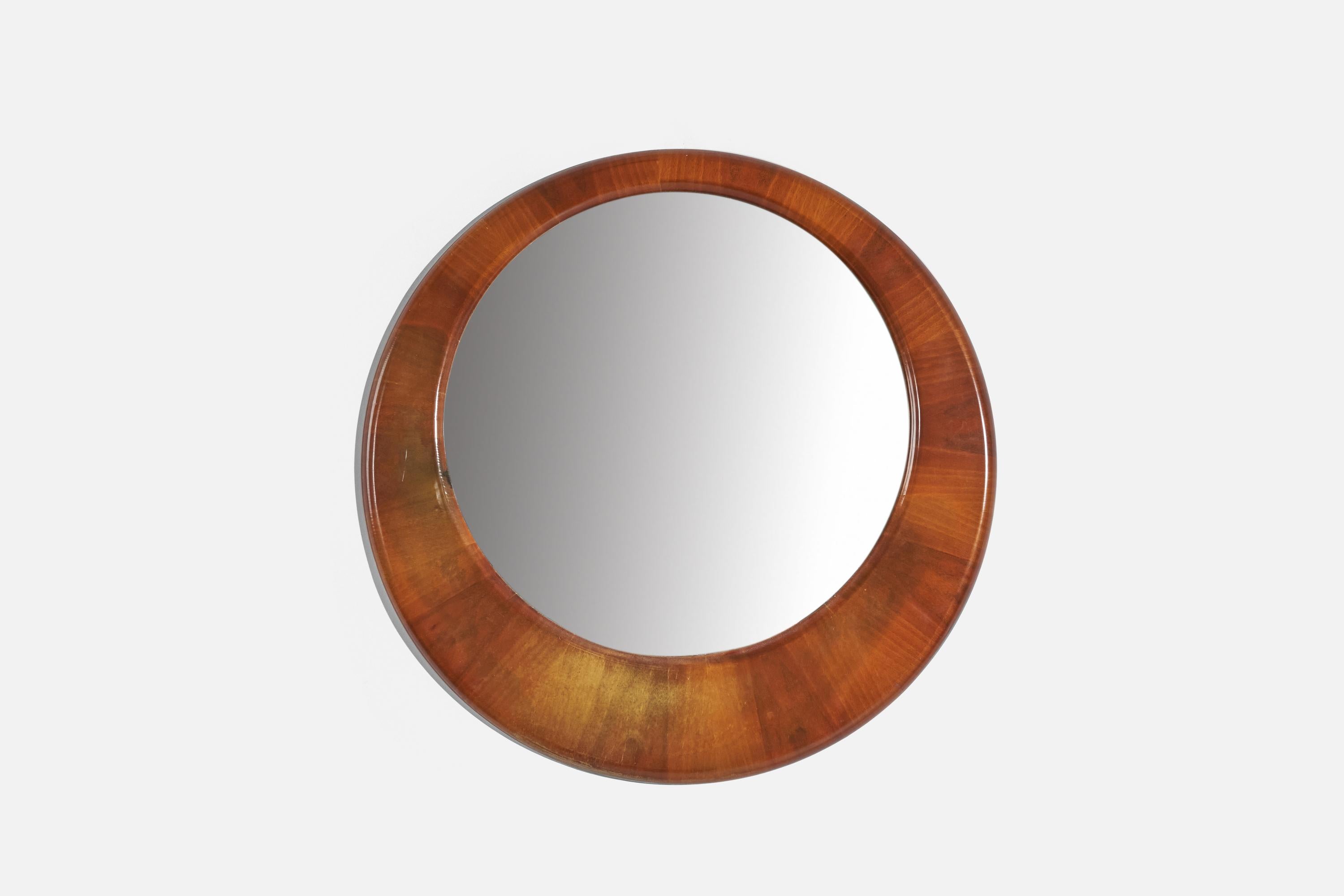 A wooden wall mirror designed and produced in Italy, 1940s.
 