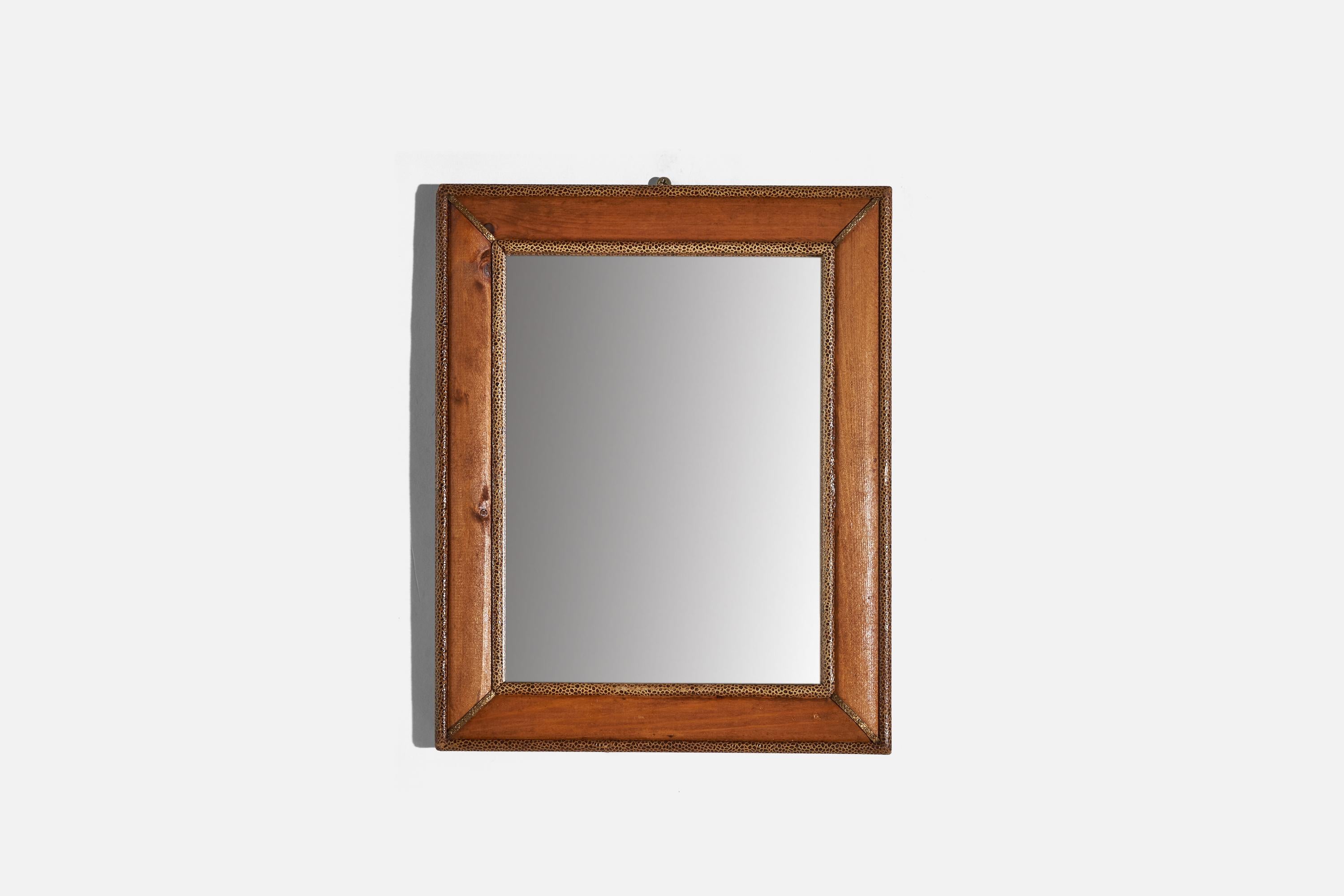A wooden wall mirror designed and produced in Italy, c. 1950-1960s.
 