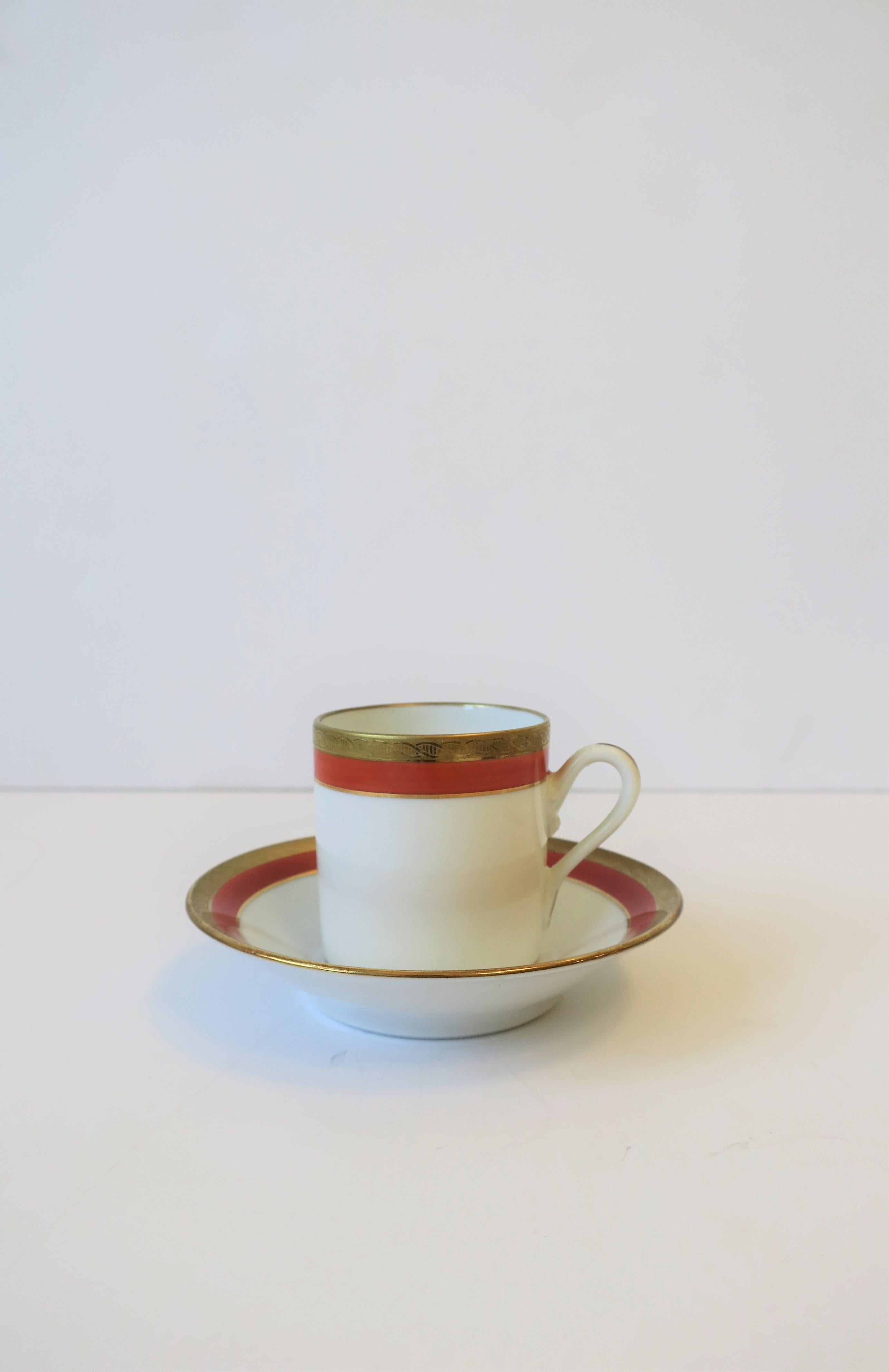 A beautiful Italian white and orange porcelain and gold gilt decoration espresso coffee or tea demitasse cup and saucer by designer Richard Ginori, circa mid-20th century, Italy. Colors include: White, orange and gold gilt. With maker's mark on