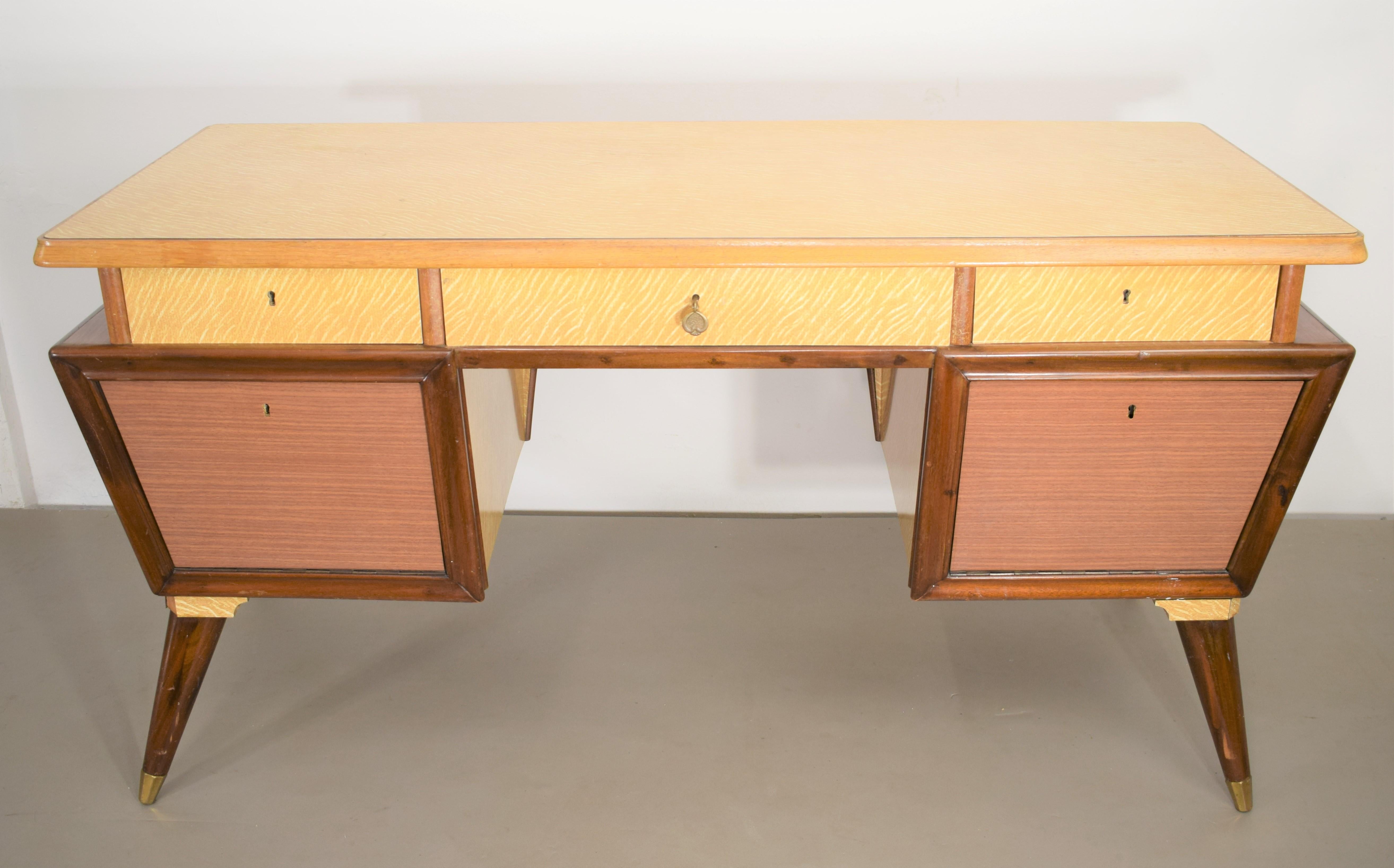 Italian desk, 1950s.

Dimensions: H= 80 cm; W= 153 cm; D= 66 cm.