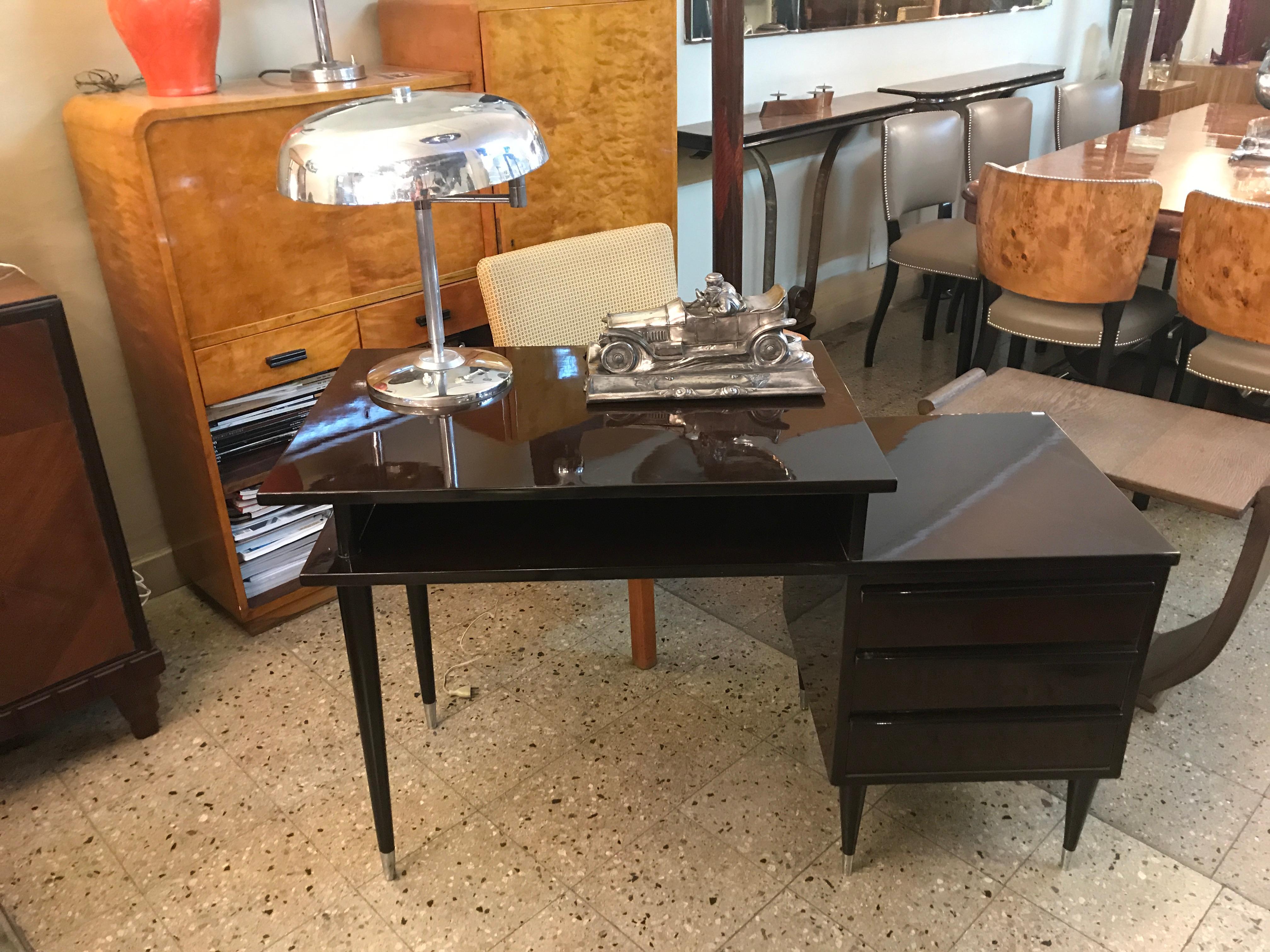 Red lacquered wood desk from the 60s, Italian.

Desk 1960s 
Country: Italian
Finish: polyurethanic lacquer
It is an elegant and sophisticated desk.
If you have any questions we are at your disposal.
If you are looking for desk lamp to match your