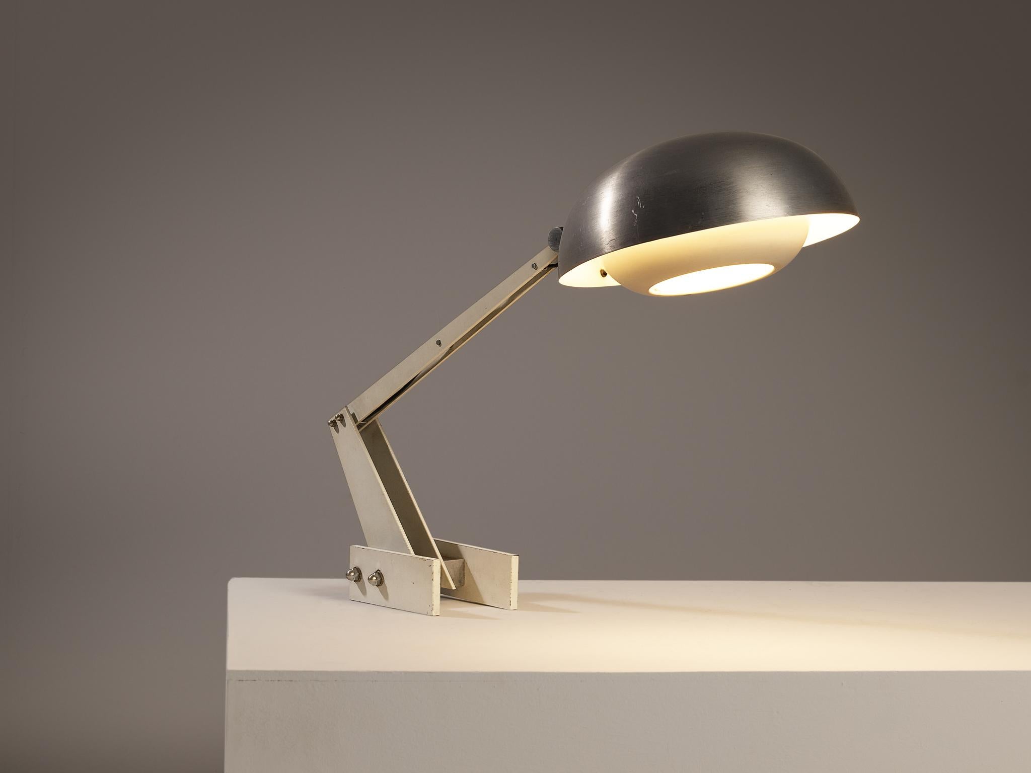 Desk lamp, coated steel, coated metal, brushed aluminum, coated aluminum, Italy, 1960s 

An Italian industrial lamp that prioritizes practicality and utility combined with a simple layout. The position of the lamp can be changed in three places by