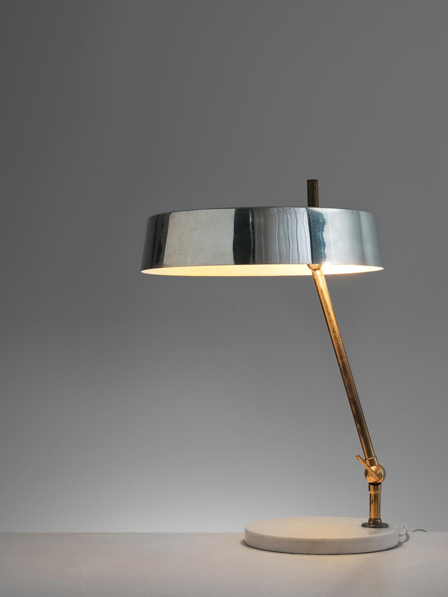 Desk lamp, marble, metal, brass, Italy, 1950s.

Stylish desk light with mirrored shade. The circular shade matched the brass stem and the marble base perfectly. The base is a white marble circle on which a brass stem stands. You can choose if the