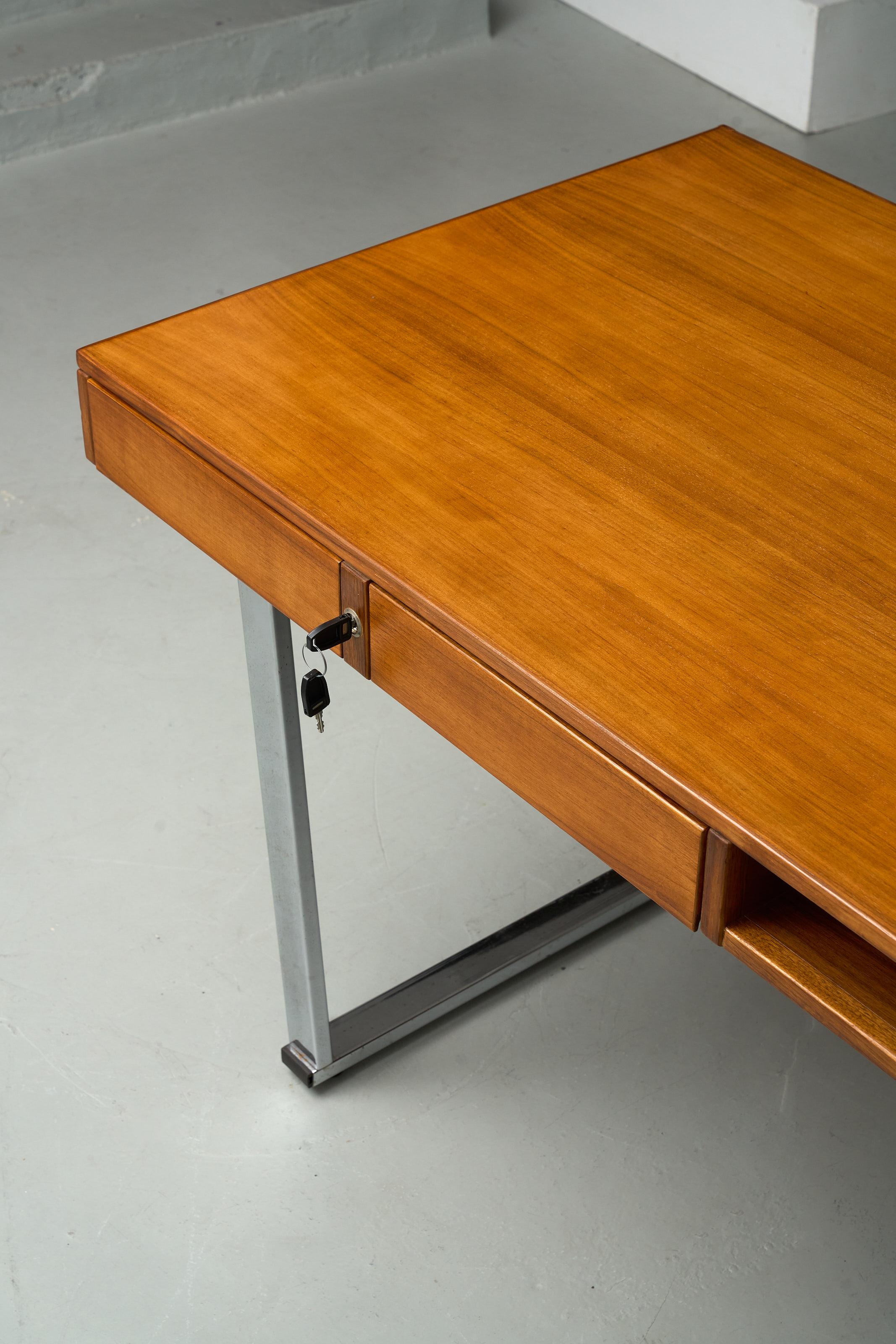 Elegant large Italian desk with 4 drawers on chromed base. 2 keys included. 
