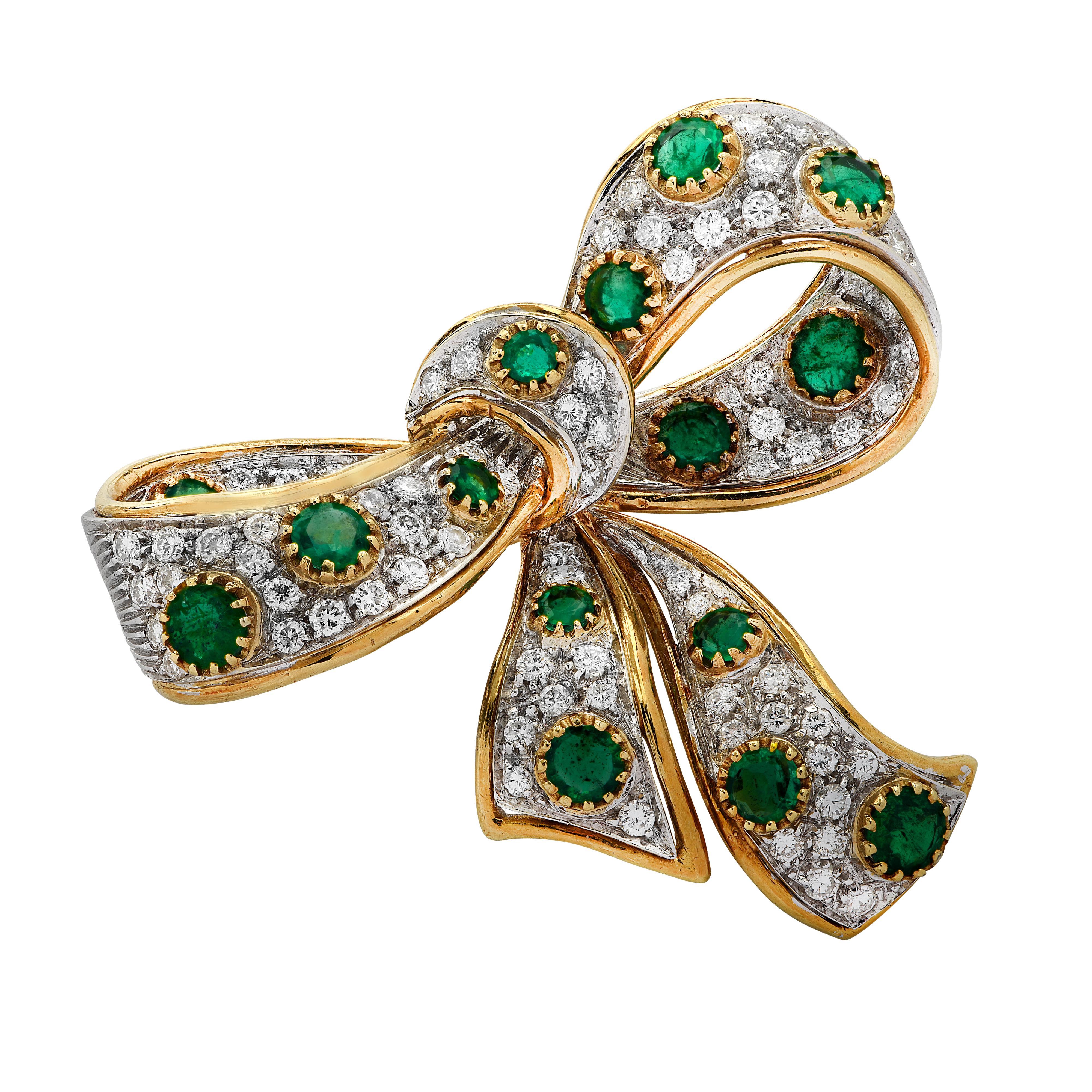 Delightful brooch pin finely crafted in Italy in 18 karat yellow and white gold, featuring  81 round brilliant cut diamonds weighing approximately 2.5 carats total, G color, VS-SI clarity and  16 round emeralds weighing approximately 2.50. This