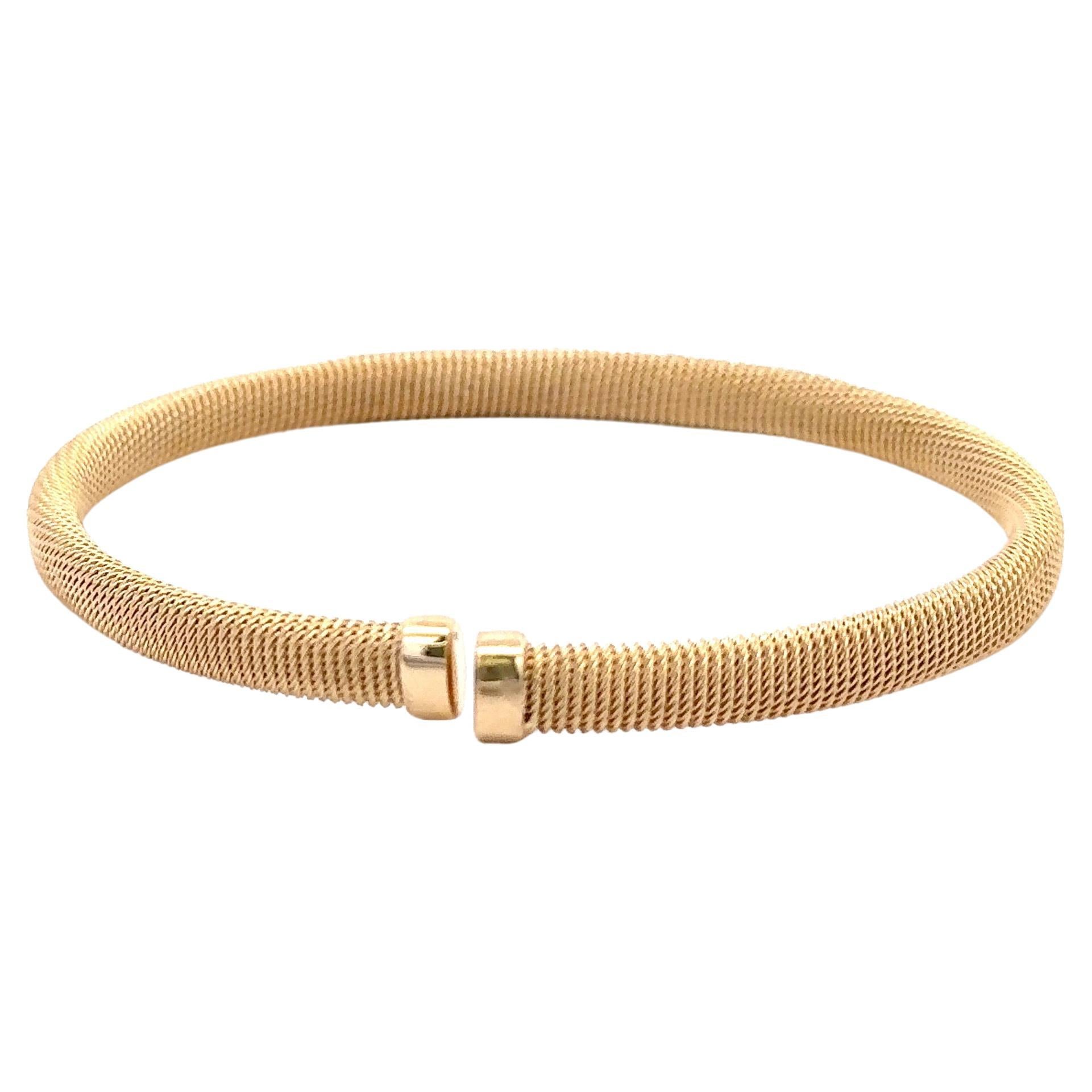 Armband aus 14 Karat Gelbgold mit geflochtenem Motiv und einer Diamantleiste mit 67 runden Brillanten von 0,58 Karat.
Farbe F
Reinheit VS1-VS2