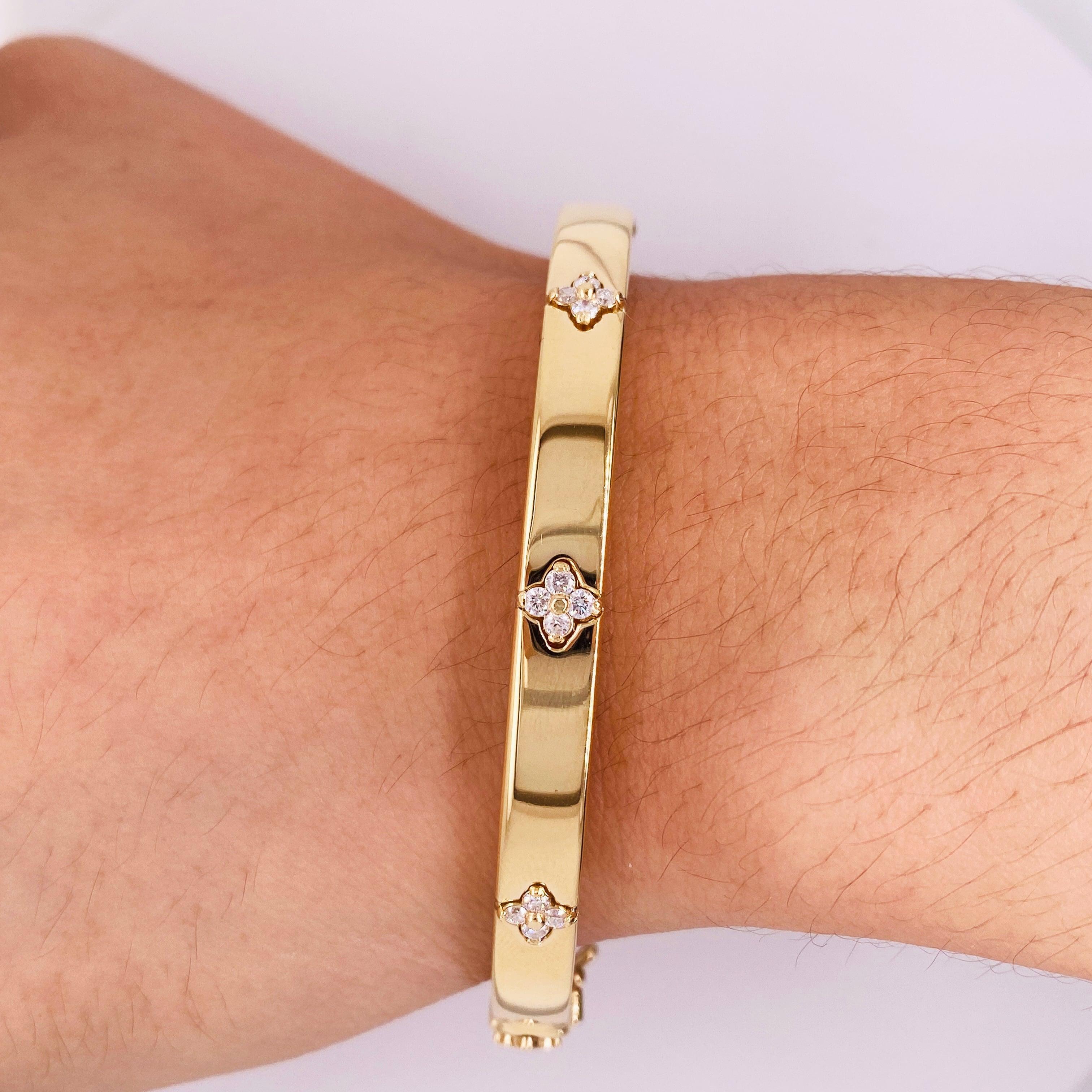 This diamond clover bracelet was made for us in Italy out of recycled 14 karat gold and finished beautifully to the high standards Italian jewelry is known for! Each of the 3 diamond clovers set across the top of the bangle is made with four