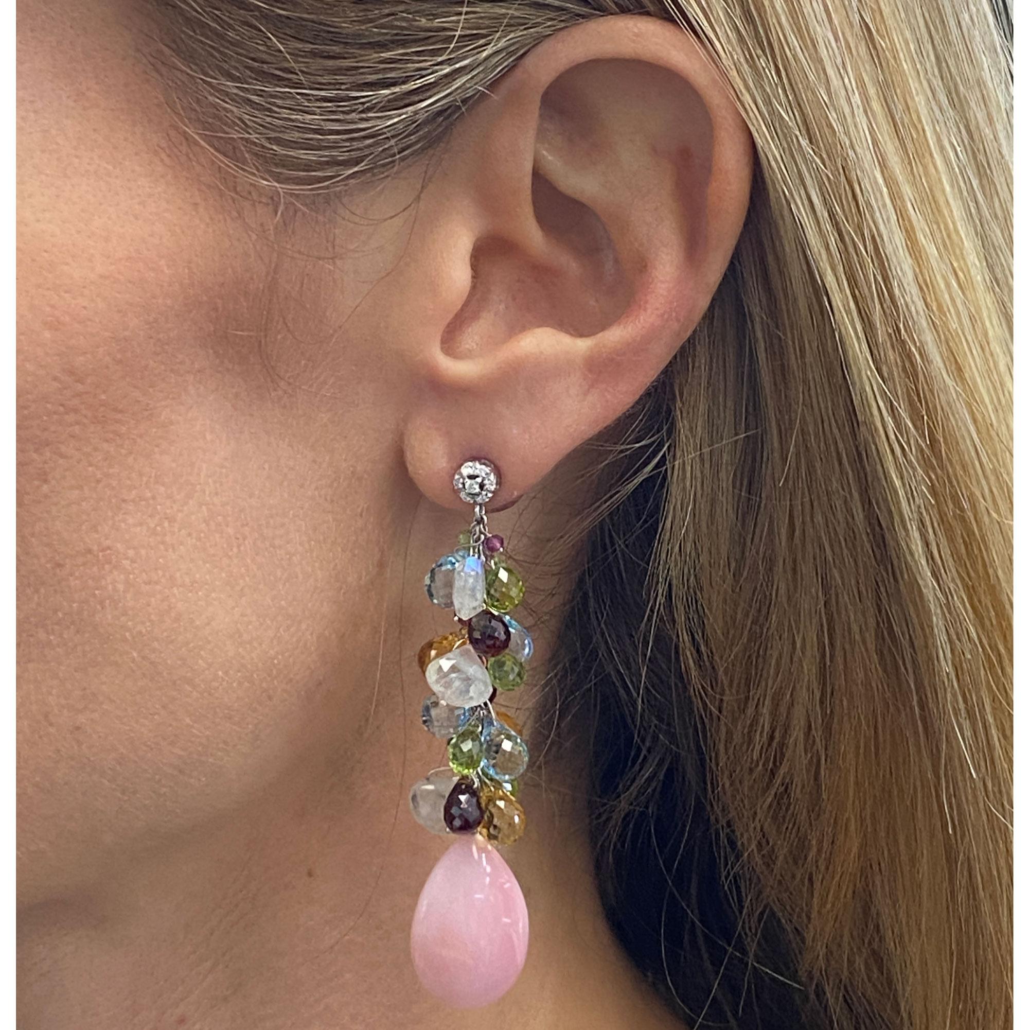 Colorful diamond and gemstone earrings by Italian designer Zoccai. The drop earrings feature round brilliant cut diamonds, colorful briolette cut gemstones, and coral drops. The earrings are fashioned in 18 karat white gold and measure 2.5 inches in