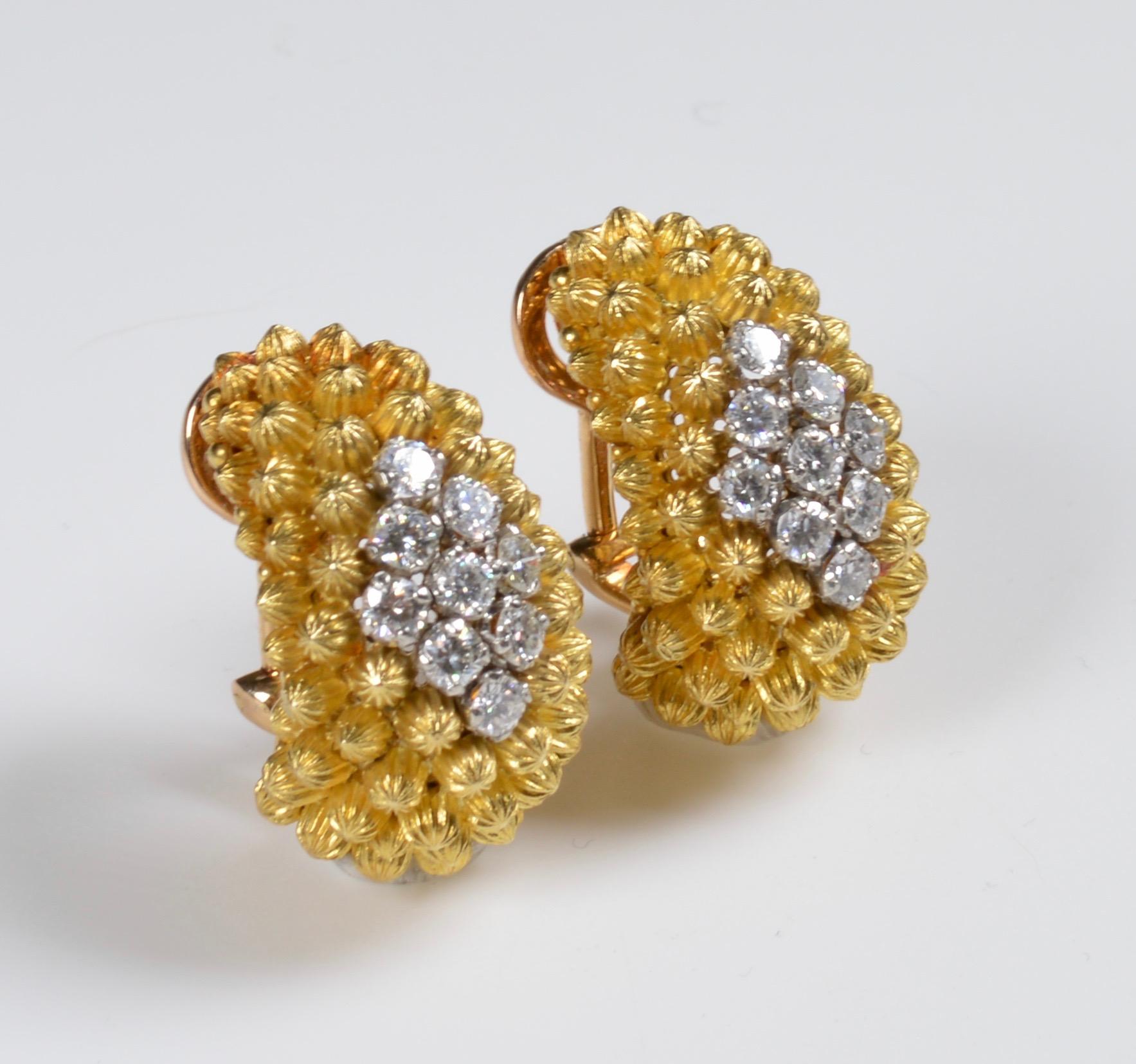 A Pair of 18 Karat Yellow Gold and Diamond Earclips, Italian, consisting of a tapered hoop design with fluted domes centered with 18 round brilliant cut diamonds of navette shaped clusters weighing approximately 1.60 carats 
Stamp: 750 (Italian
