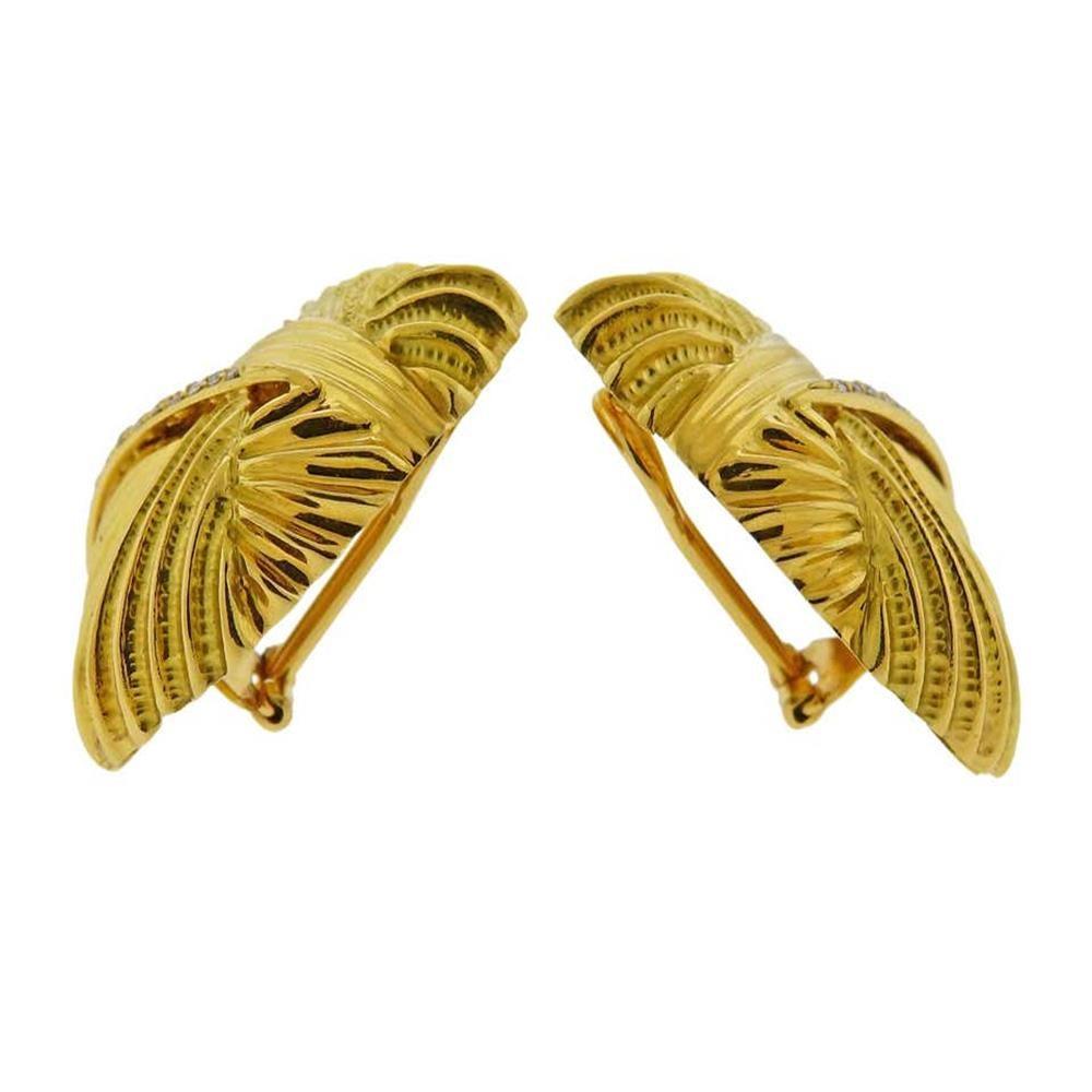 Pair of large 18k gold  Italian crafted earrings, adorned with approx 0.30ctw in diamonds. Earrings measure 35mm x 34mm. Marked 750, Italian mark and Designer's signature (illegible). Weigh 20.1 grams.
