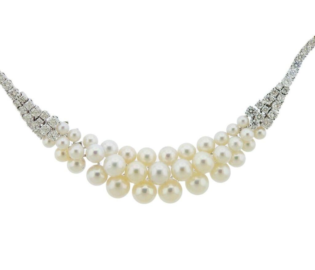 18k gold necklace crafted in Italy. Necklace features approx 5.35ctw in VS G diamonds and pearls ranging from 4mm-7.5mm. Necklace is 16