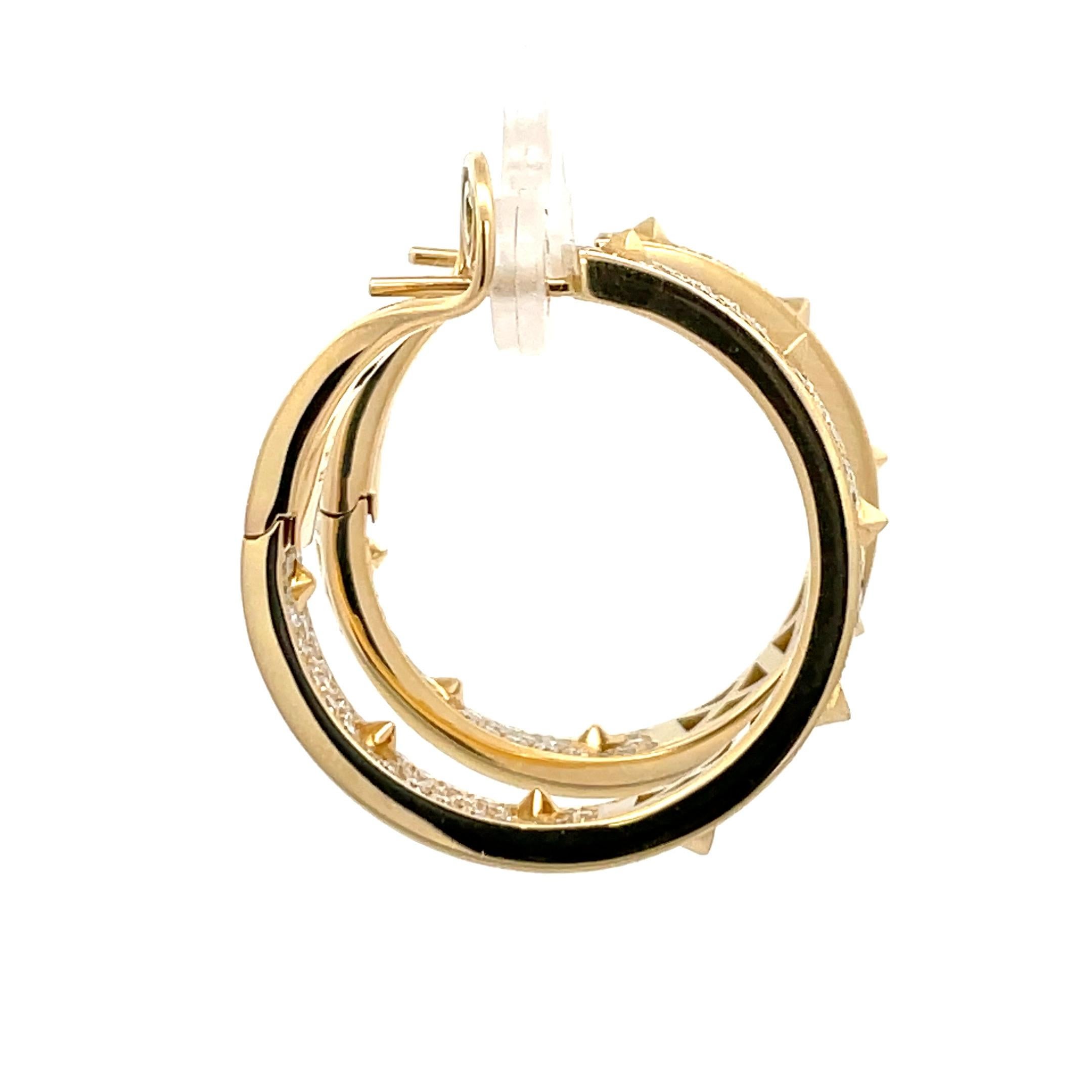 Italian spiked hoop earrings featuring numerous diamond brilliants weighing 2.60 carats, 18 Karat yellow gold.
Color F
Clarity VS
Designer: Crivelli Jewelry 
