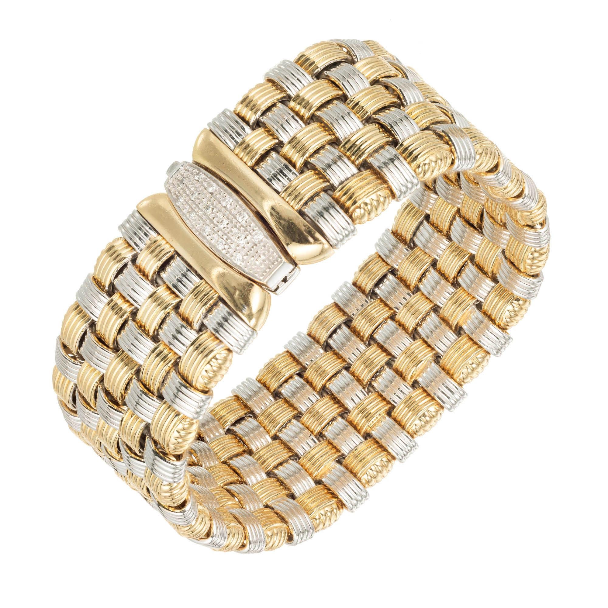 OTC Italian 18k yellow and white gold mesh bracelet with diamond catch. Circa 1960-1970.

15 round diamonds, .01ct each, approx. total weight .15cts, H, SI1
Length: 7.5 inches
18k yellow and white gold
Tested and stamped: 18k
Hallmark: OTC