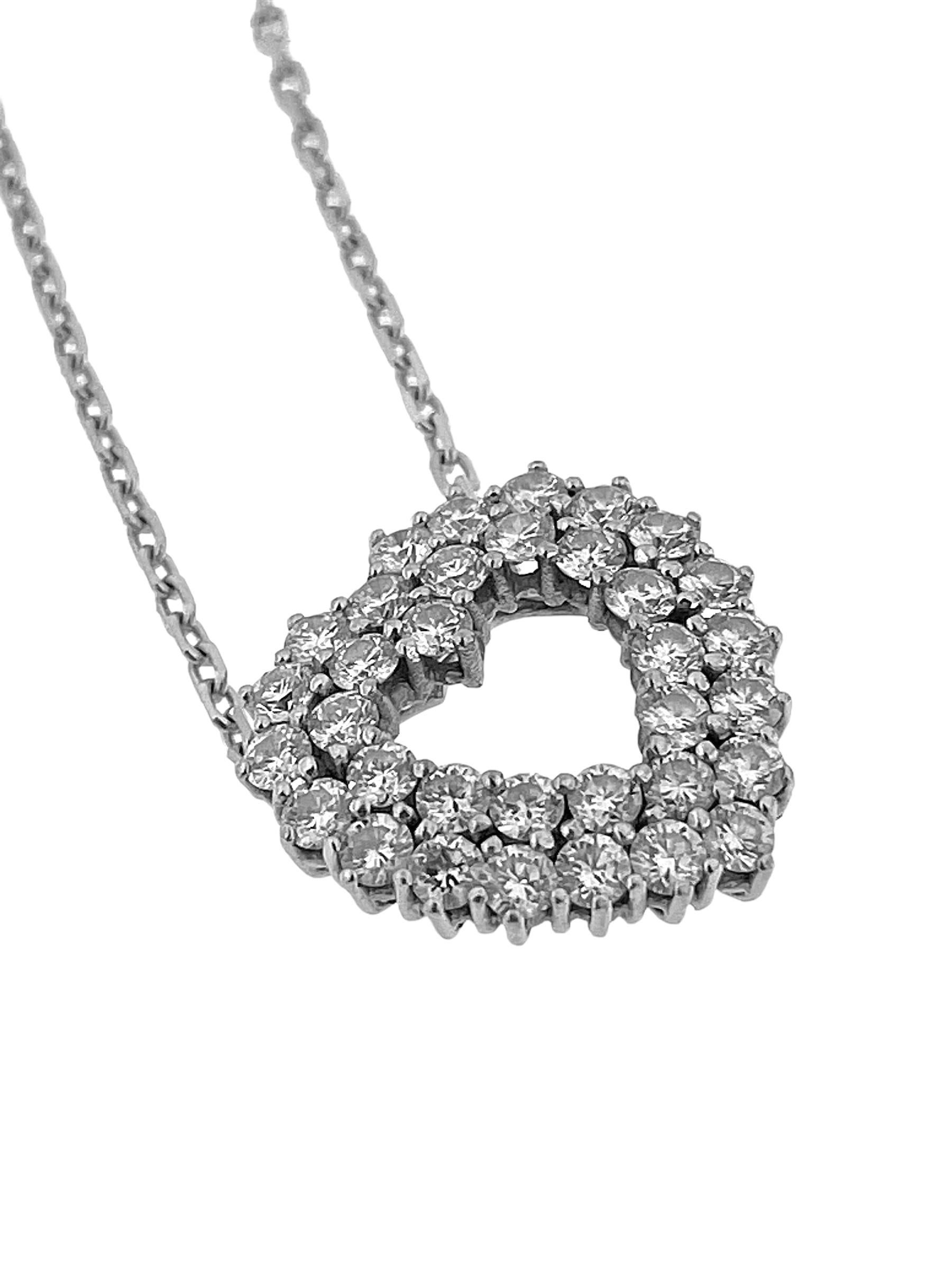 The Italian Diamonds Heart Necklace in 18 karat White Gold is a breathtaking expression of love and sophistication. Crafted with exquisite attention to detail, this necklace features a heart-shaped pendant adorned with dazzling diamonds, set in