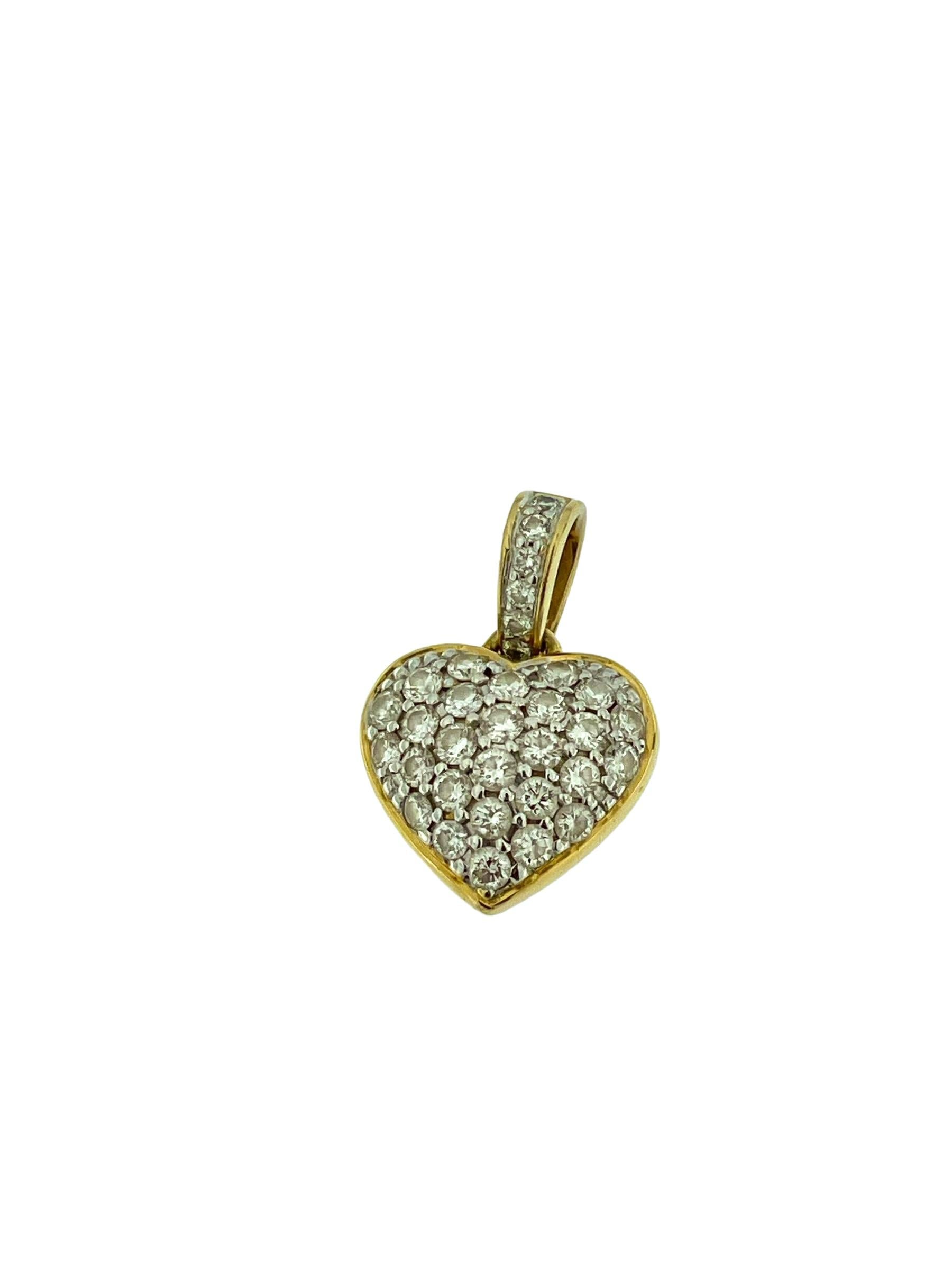 The Italian Diamonds Heart Pendant in 18-karat Yellow and White Gold is a stunning symbol of love and elegance. Crafted with precision and artistry, this pendant features a heart-shaped design adorned with a total of 33 diamonds.

The diamonds,