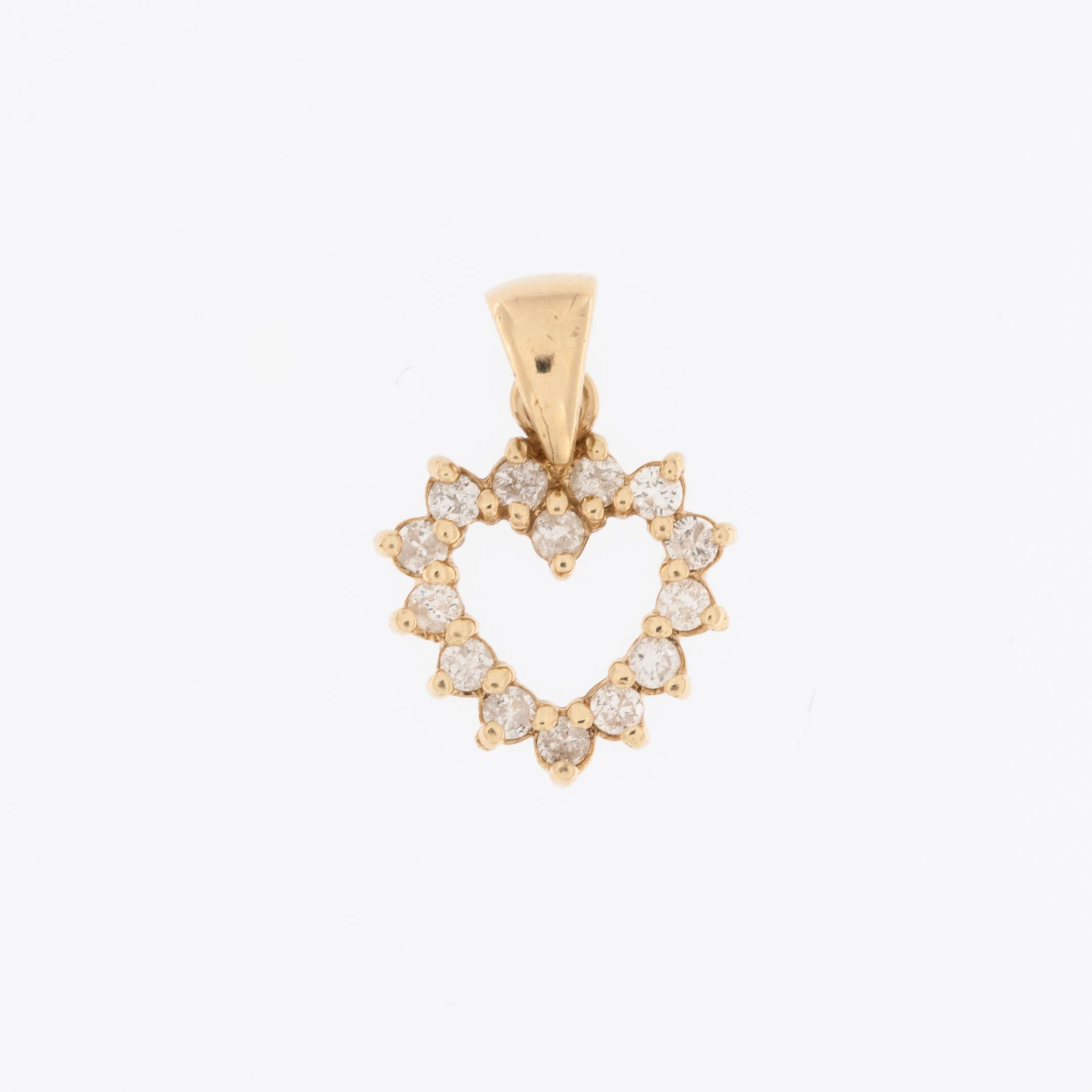 The Italian Diamonds Heart Pendant in Yellow Gold is a captivating expression of love and refinement. Crafted with meticulous attention to detail, this pendant features a heart-shaped design crafted from 18-karat yellow gold, exuding warmth and
