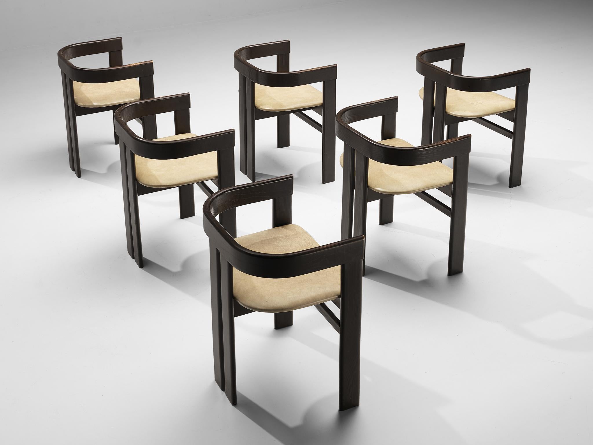 Set of six dining chairs, oak, leather, Italy, 1970s 

Italian dining chairs that have a strong resemblance to Augusto Savinis 'Pamplona' chair (1965) and Afra & Tobia Scarpa's 'Pigreco' chair (1959-1960) yet this design is different in its details.