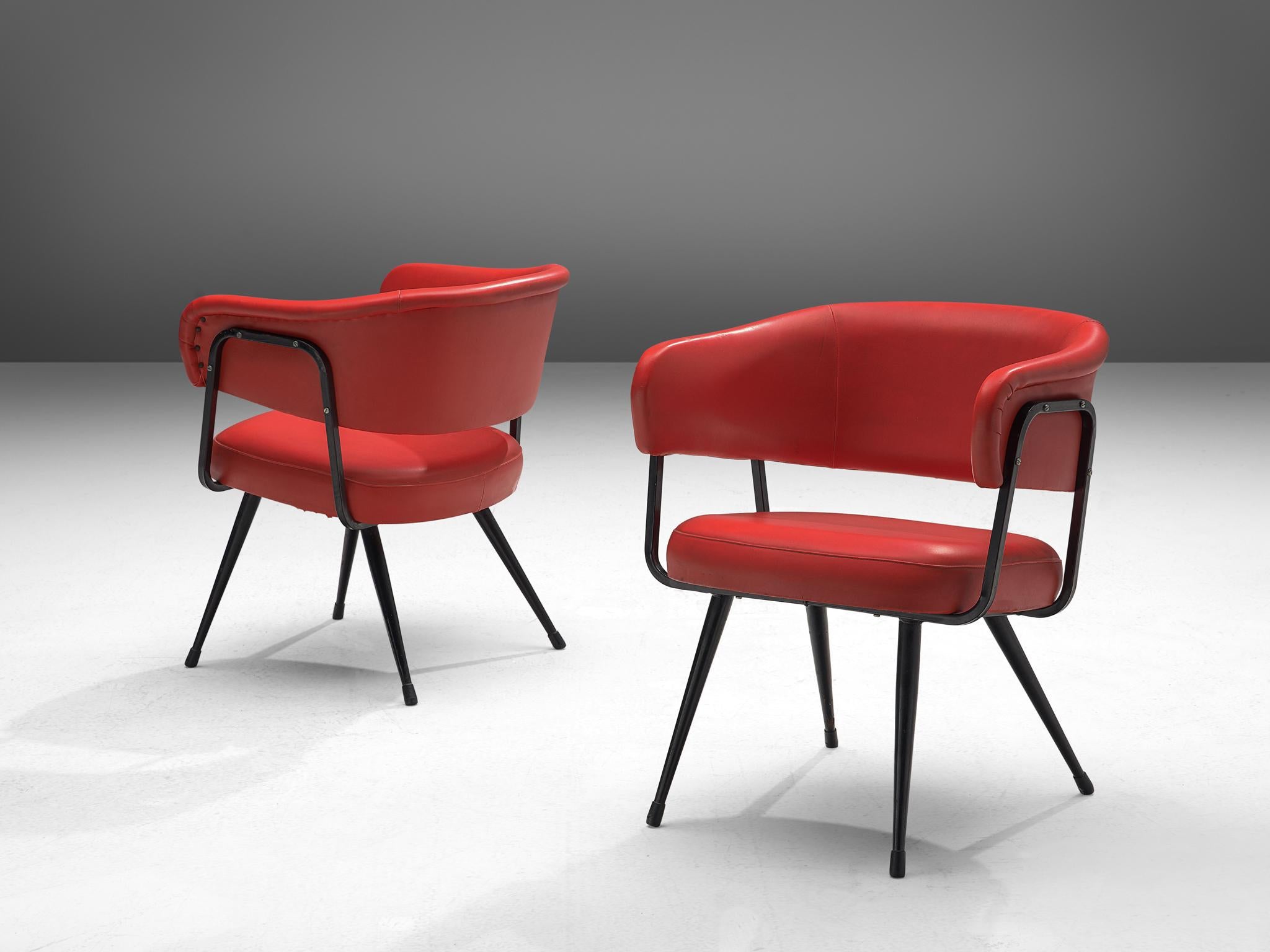 Dining chairs, leatherette, metal, Italy, 1970s

This set of dining chairs features a red seat combined with a black lacquered steel frame. The backrests are curved and surround the sitter, creating a comfortable and embracing feeling. The black