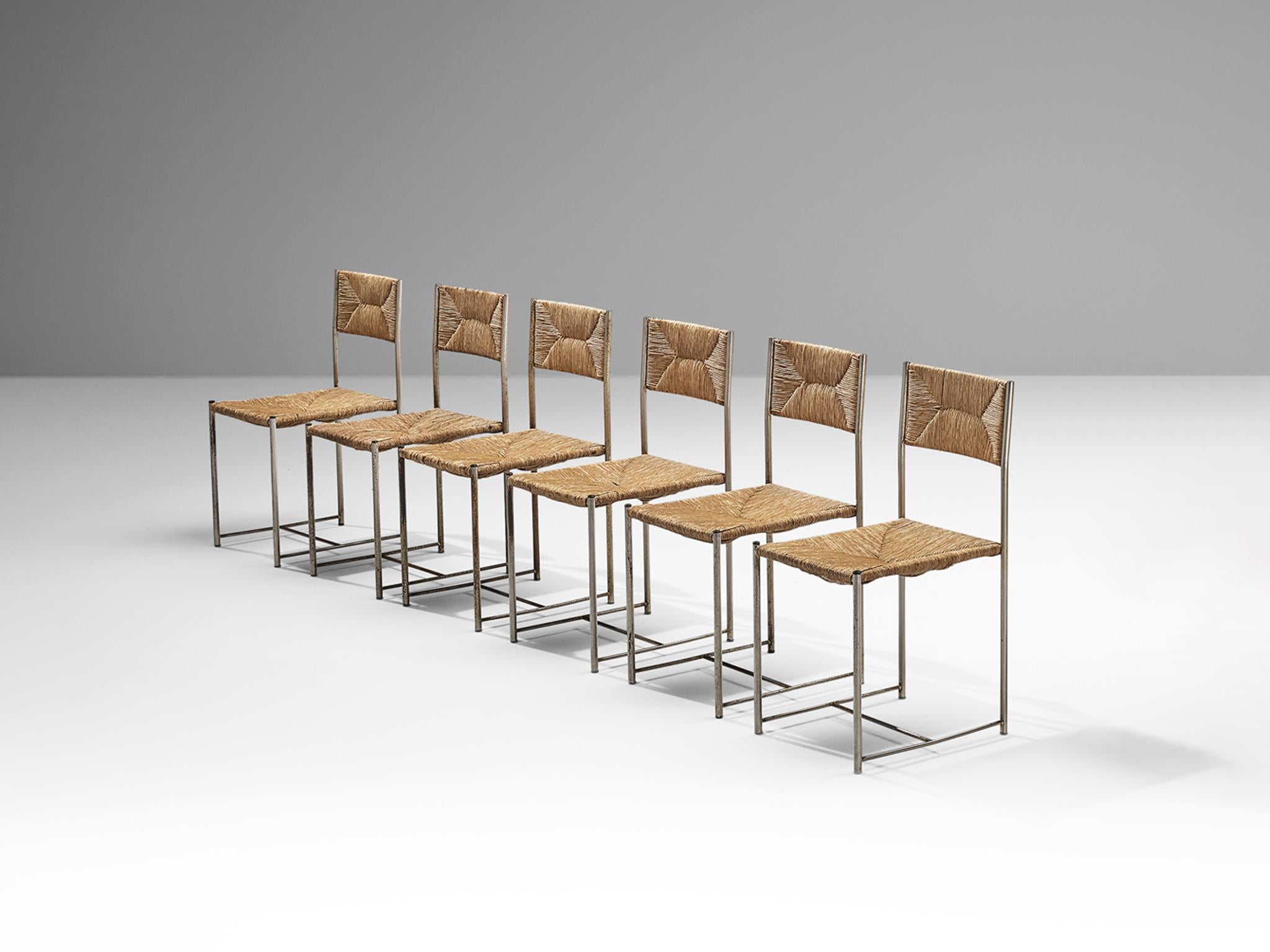 Dining room chairs, patinated steel and straw, Italy, 1970s

A beautiful large set of chairs made in Italy in the 1970s. These chairs are characterized by clear lines and the use of metal in combination with natural material for the seats and