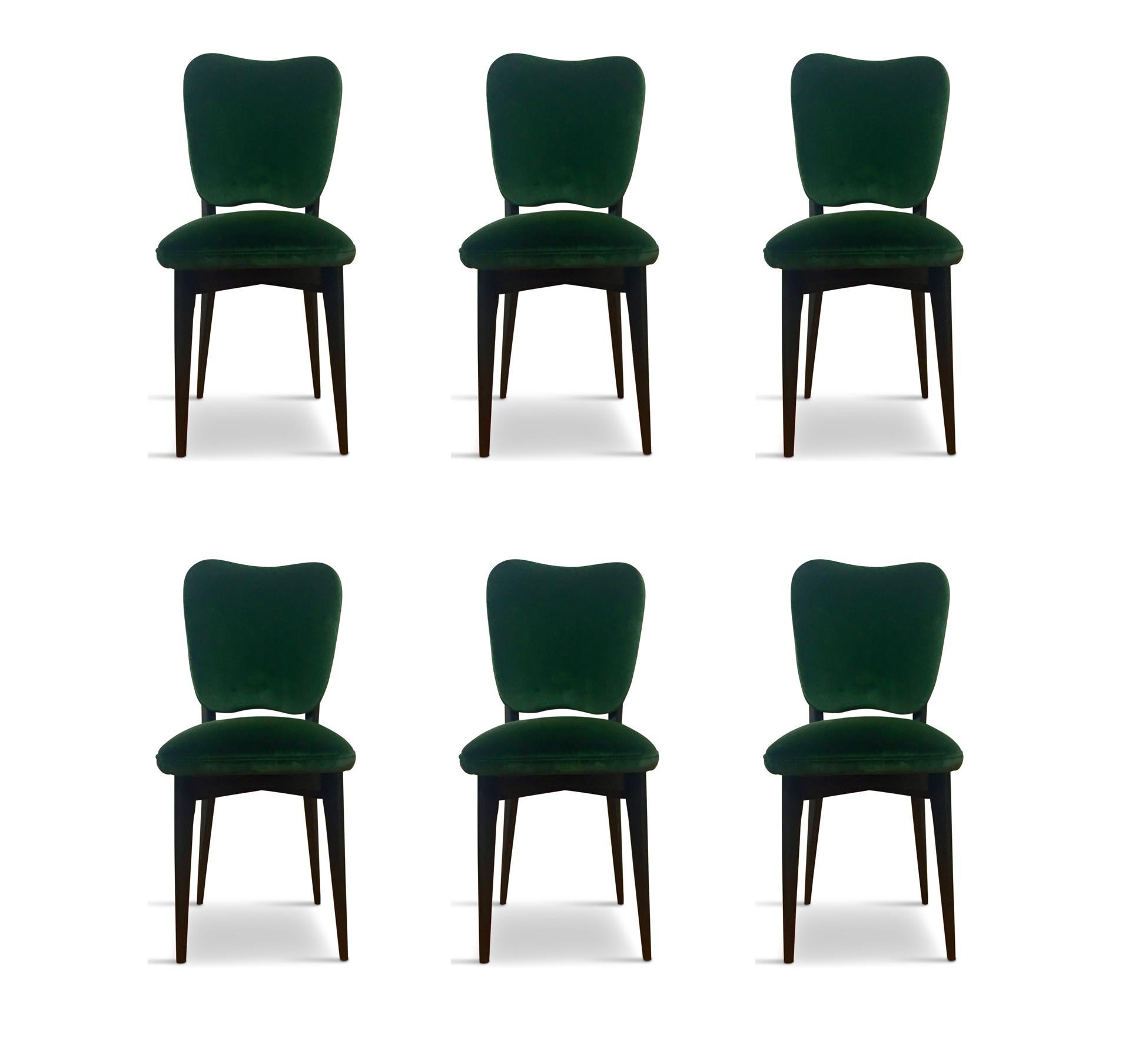 These six Italian dining chairs are in the style of Ico Parisi and have had a ground up restoration including an ebonized X frame base and new upholstery.

 