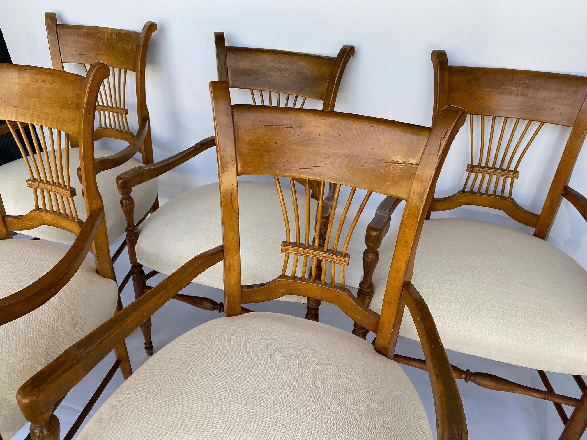 Italian provincial-style set of six armchairs. The seats are covered in linen.