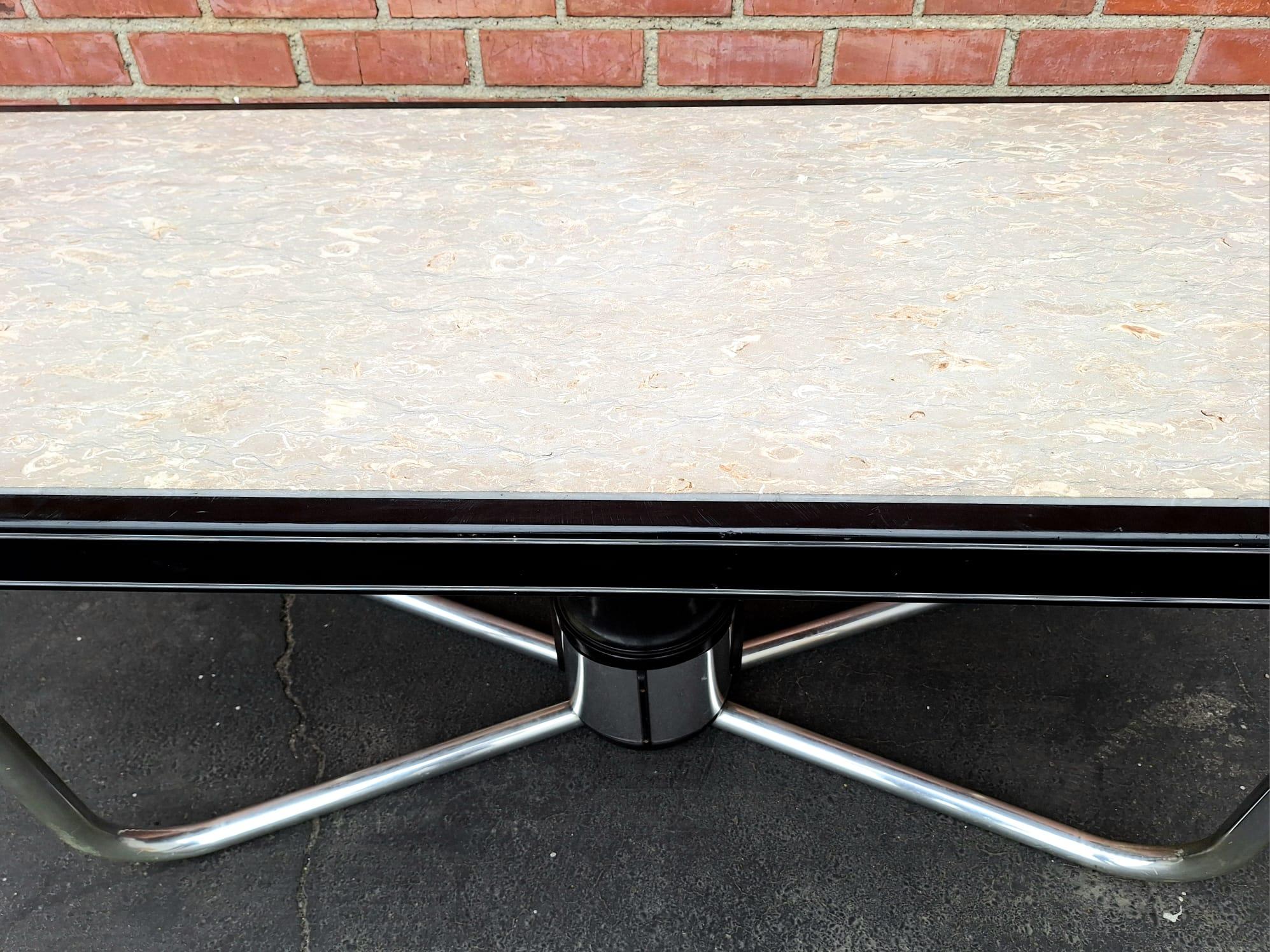 Italian table represent in style of Giotto Stoppino, an influential Italian architect and designer, is renowned for his modern and innovative furniture designs, particularly from the mid-20th century. His work often embodies the sleek lines and