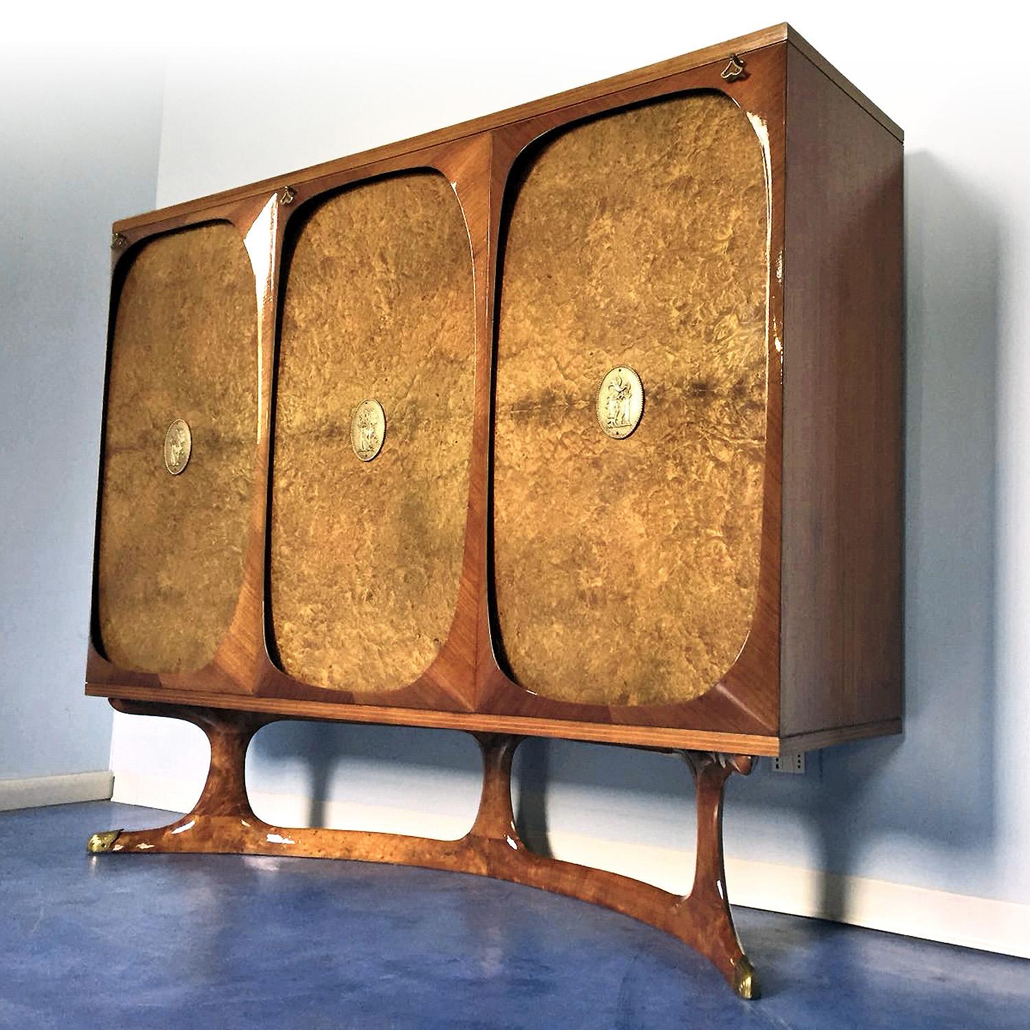 Very rare and fine Italian dining set composed by two sideboards, designed by Vittorio Dassi in the 1950s.

Both items have been manufactured with precious birch briar root and finished with brass details, and both have the basements characterized