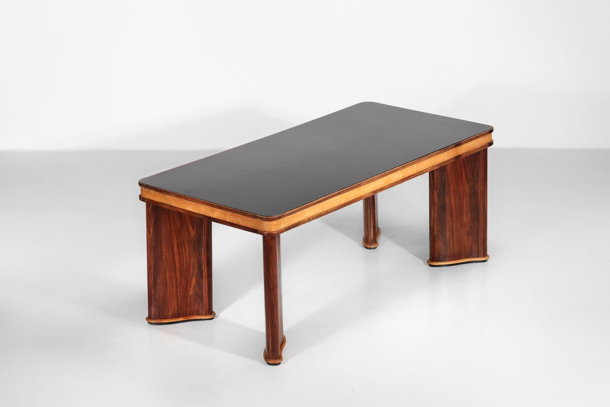Dining table from 1950s attributed to Osvaldo Borsani.
Top in glass with a wood structure.
Nice design of the leg.