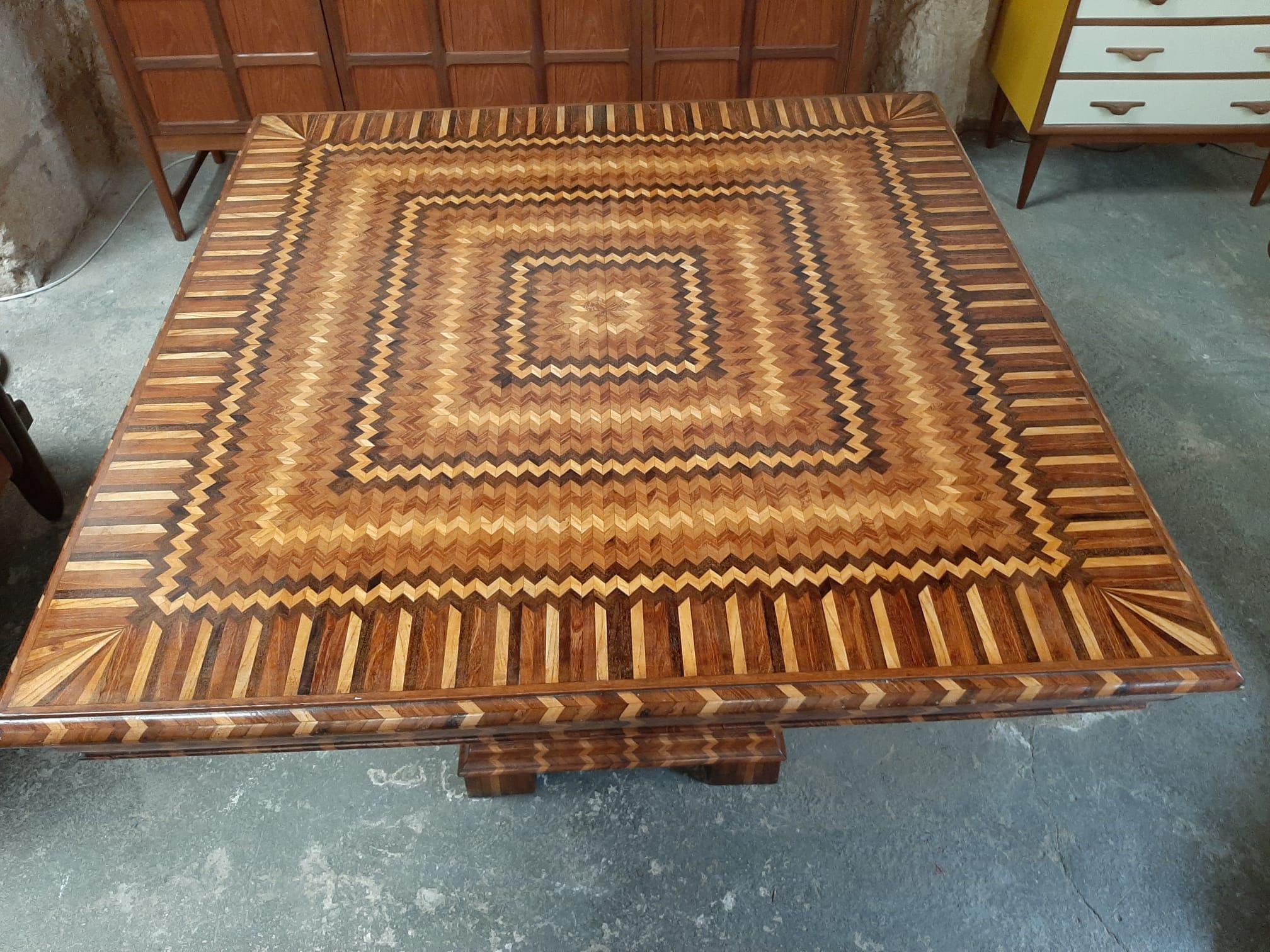 Gorgeous and one of a kind Italian table made to order in the 1940s, table in marquetry of various woods such as teak, lemongrass and walnut. 

An authentic, unrepeated, eccentric work of art!

Approx. dimensions:
Width 110cm
Length