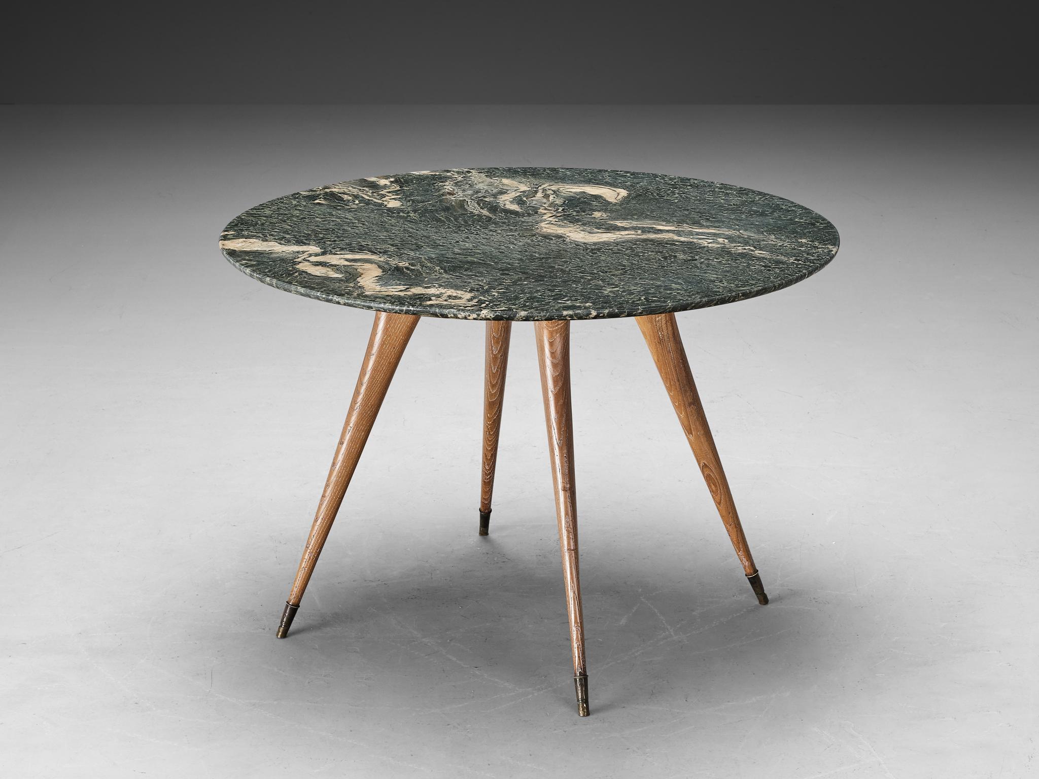 Dining table, marble, cerused chestnut, brass, Italy, 1940s

A charming dining table of Italian origin and dating back to the 1940s, encapsulates the Art Deco flair of that period. The top is truly gorgeous, featuring a large round green marble slab