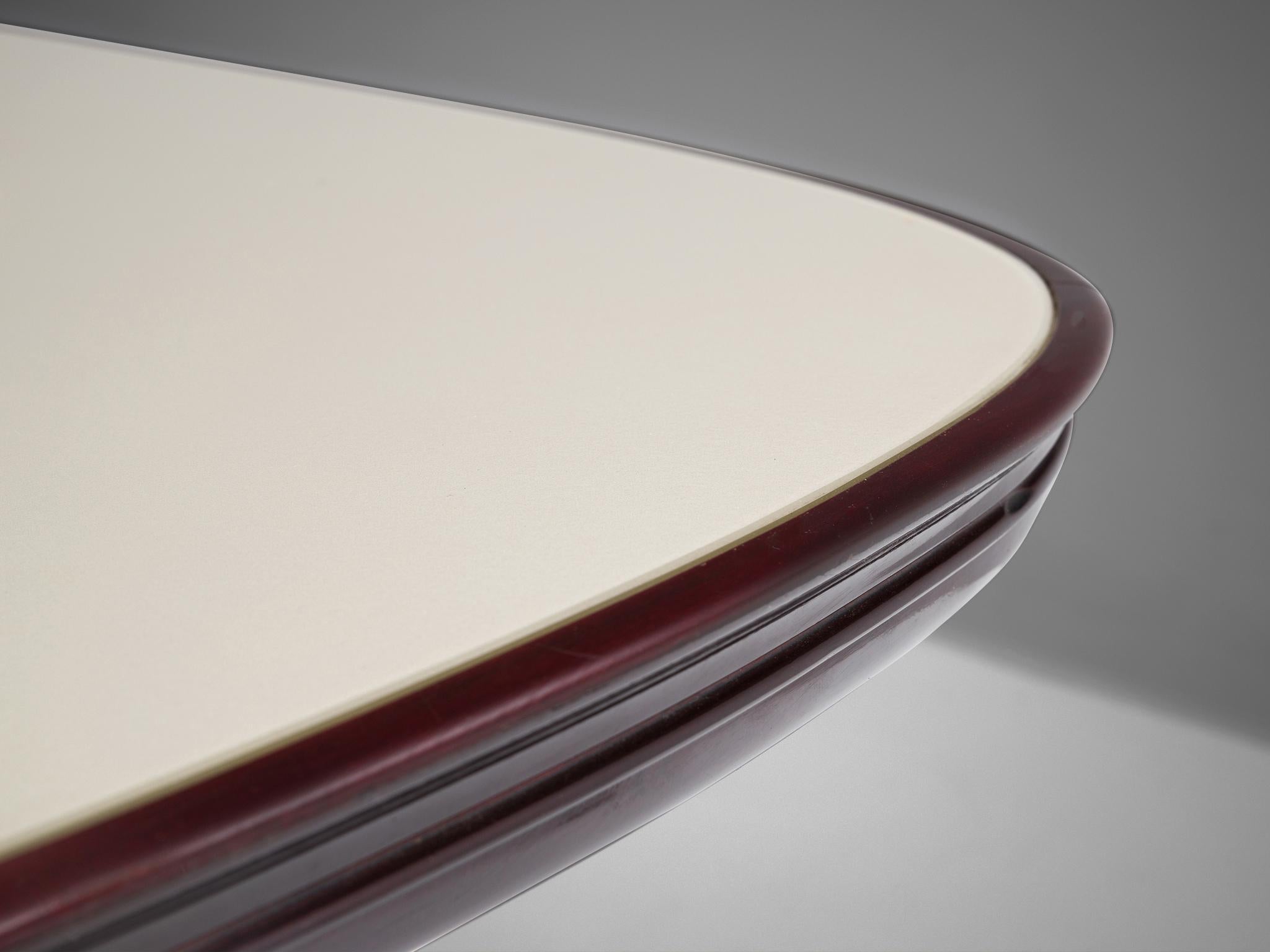 Dining table, marble, glass and mahogany, Italy, 1950s.

Luxurious table with a marble base and glass top in the style of Italian designer Vittorio Dassi. On a marble plate follows an organic and amorph shaped base consisting out of two V-shaped