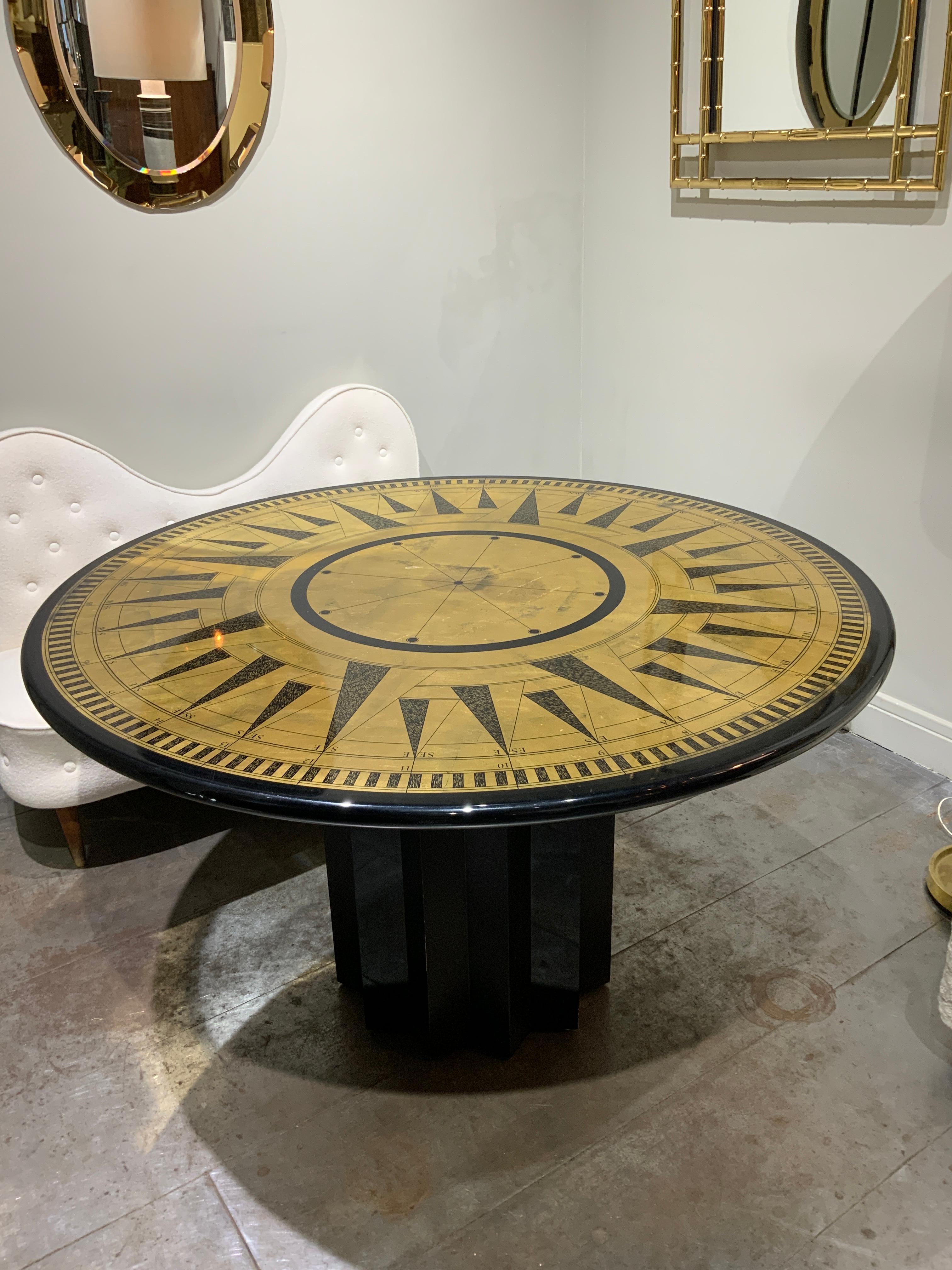 Beautifull Italian dining or center table circa 1970 in lacquered wood 
Top with compass rose in gold and black decoration 

