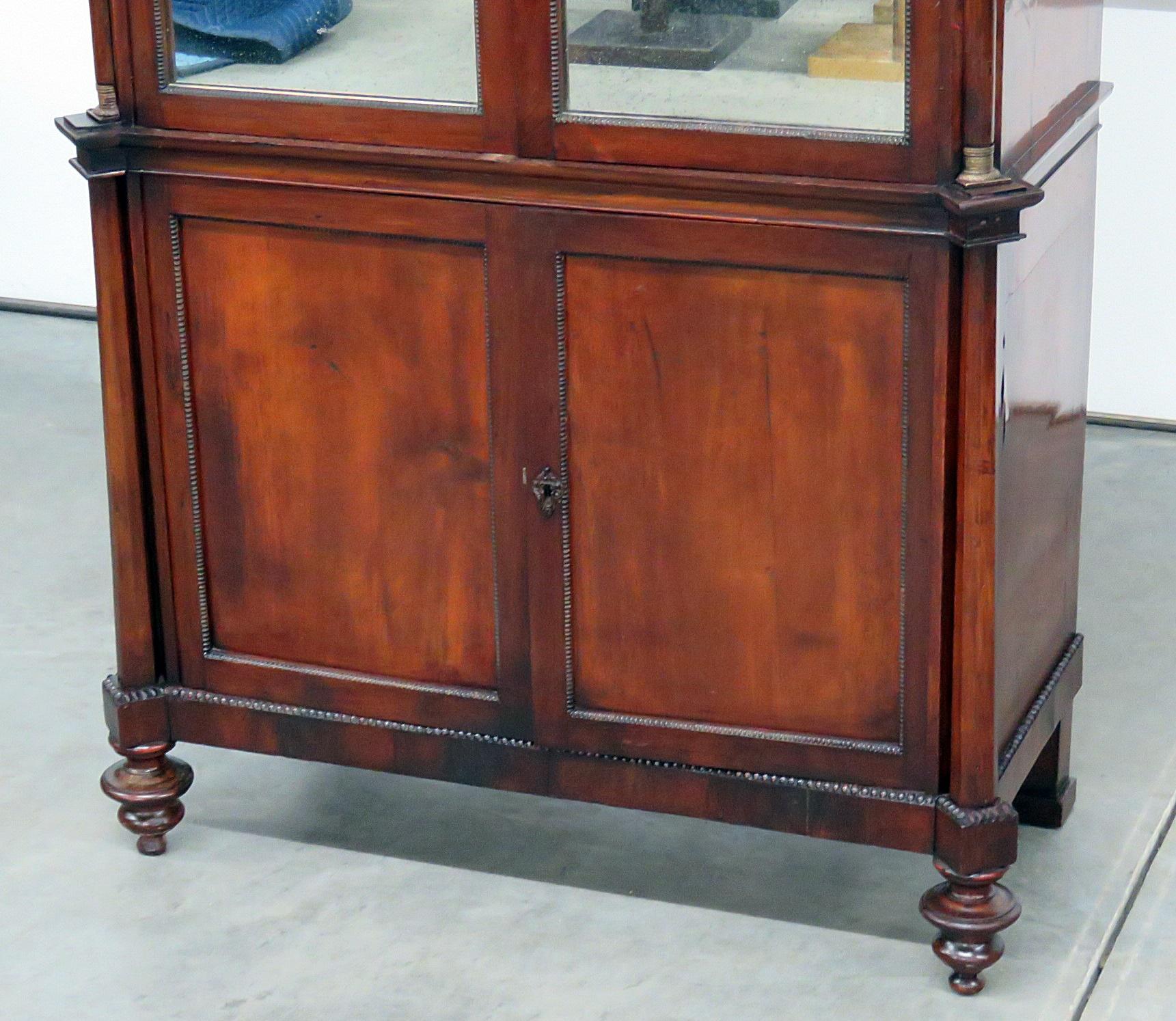 Italian Directoire style bronze mounted marble-top cabinet with 2 doors (with distressed mirrors) containing 2 shelves over 2 doors.