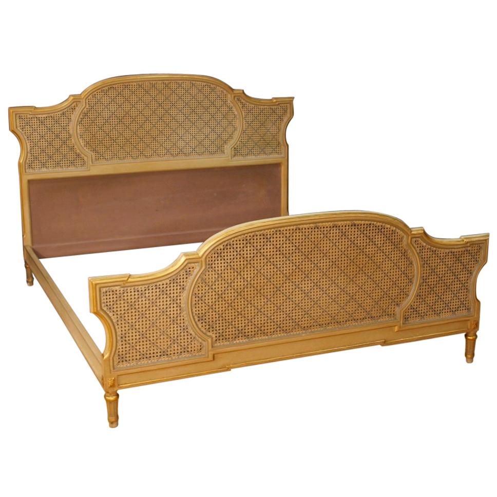 Italian double bed from the mid-20th century. Furniture in carved, lacquered and gilded wood in Louis XVI style. Bed of great size and impact that can accommodate an internal structure of the following maximum sizes: W 170 x D 197 cm. Headboard and