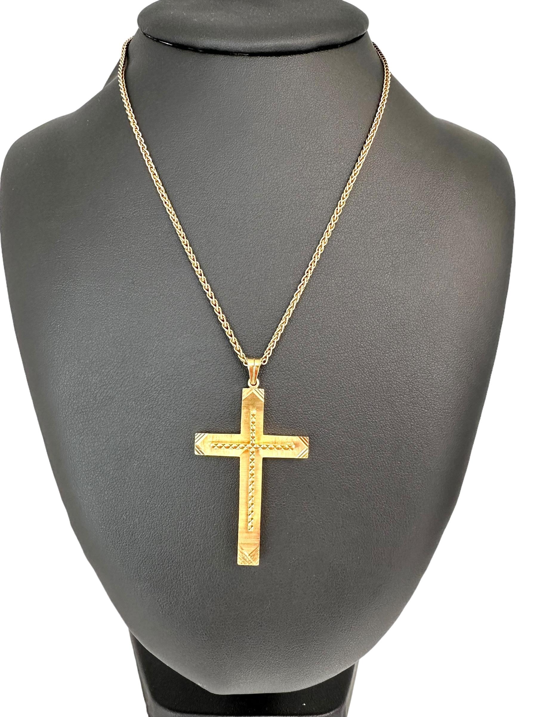 This Italian Double Cross Yellow Gold Pendant exudes a sense of elegance and spirituality. Crafted from luxurious 18kt yellow gold, this pendant features a unique design with a smaller cross resting atop a larger one, creating a layered and