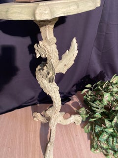 Italian dragon pedestal table with patina dating from the 19th century