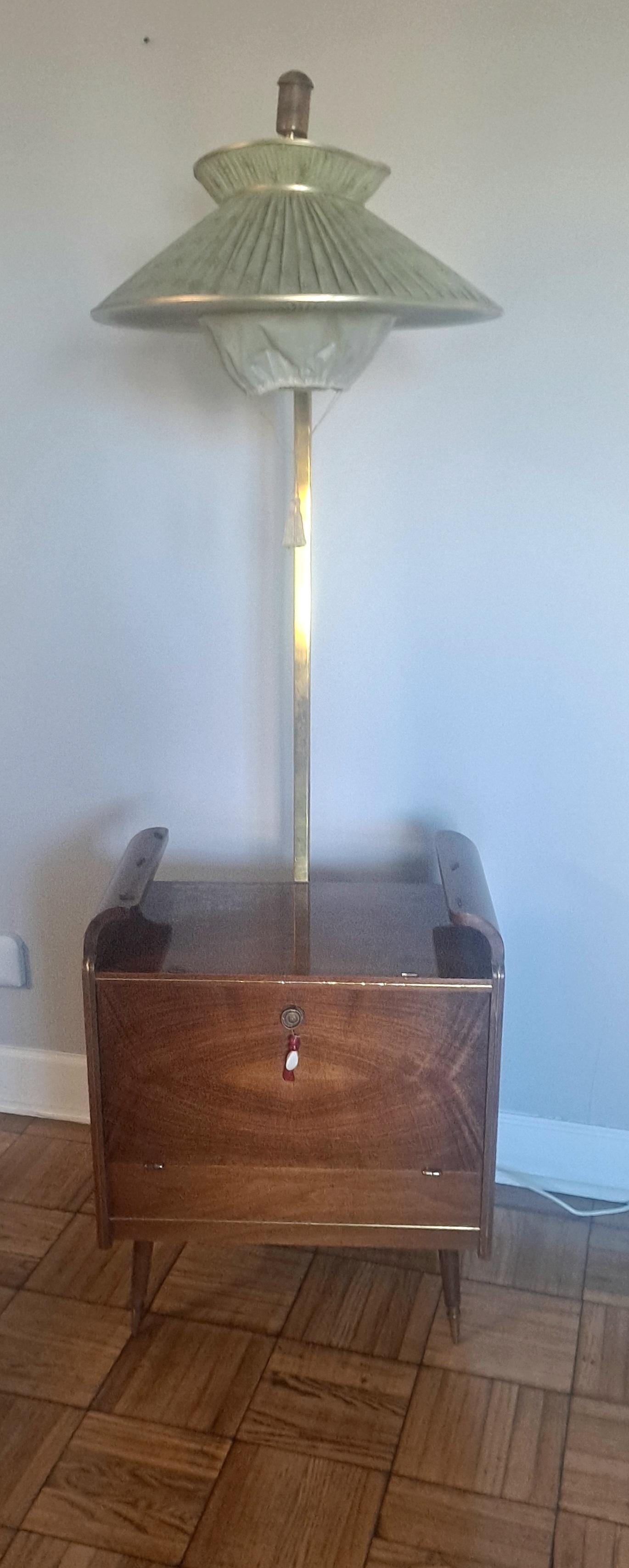  Italian 1950s floor lamp -dry bar. Dry bar have 2 lights bulbs and  when the door closes, the switch automatically turns off. Switch for the floor lamp is on the floor neck back. The legs brass boots are on the bottom of the lamp. Walnut wood base