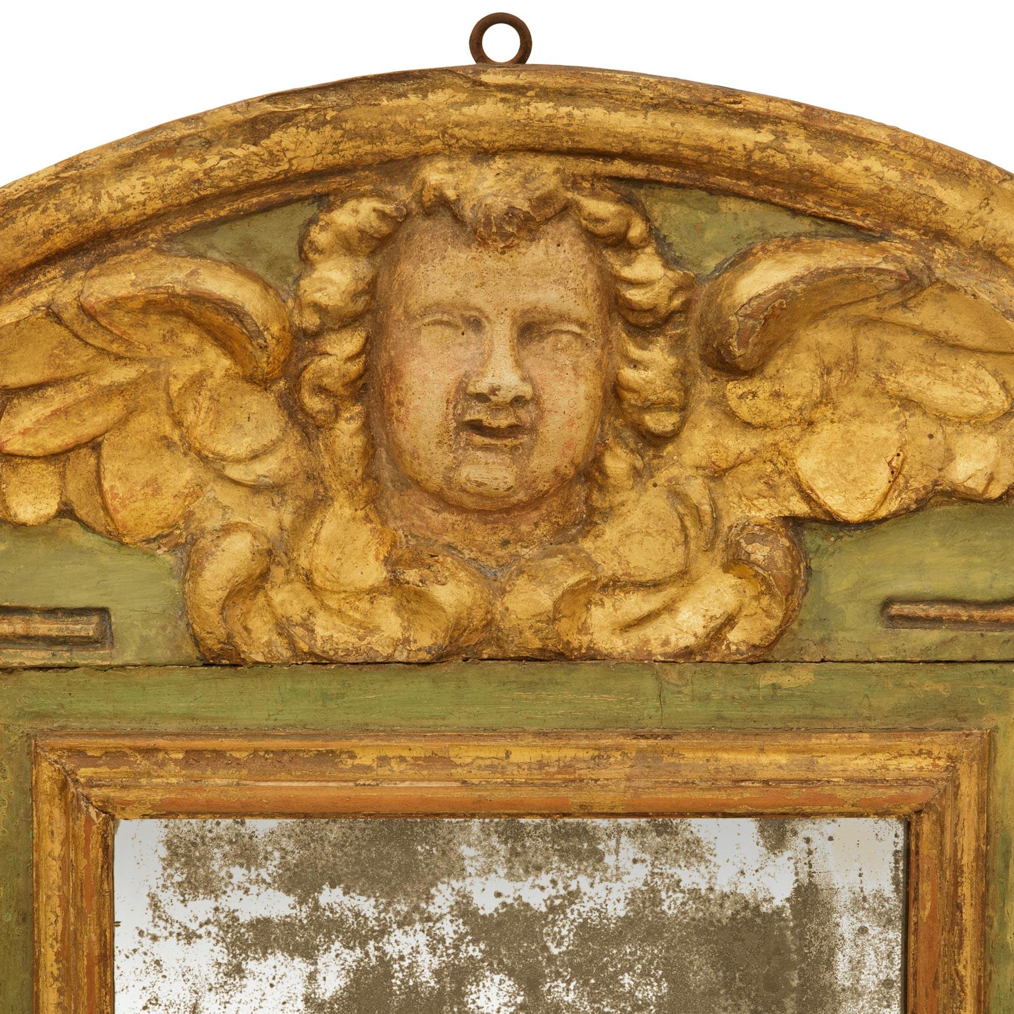 18th Century and Earlier Italian early 18th century Baroque Period patinated Wood and Giltwood mirror For Sale