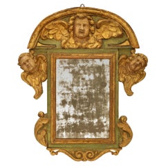 Antique Italian early 18th century Baroque Period patinated Wood and Giltwood mirror