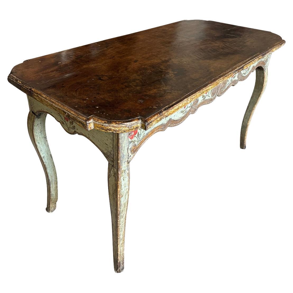 An exceptional and very lovely early 18th century Console Table from Venice, Italy.  Beautifully constructed from polychromed wood with a solid board walnut top, gentle cabriole legs and outstanding floral painted detailing.  A very elegant piece. 