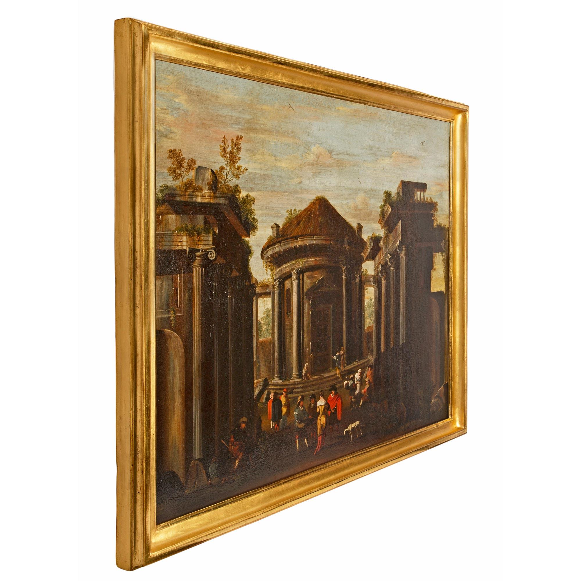 Ein sehr attraktives italienisches Öl auf Leinwand aus dem frühen 18. Jahrhundert mit einem architektonischen Thema. Das Gemälde zeigt einen zentralen runden Pavillon inmitten von Ruinen, die von vier ionischen Säulen akzentuiert werden. Im Zentrum
