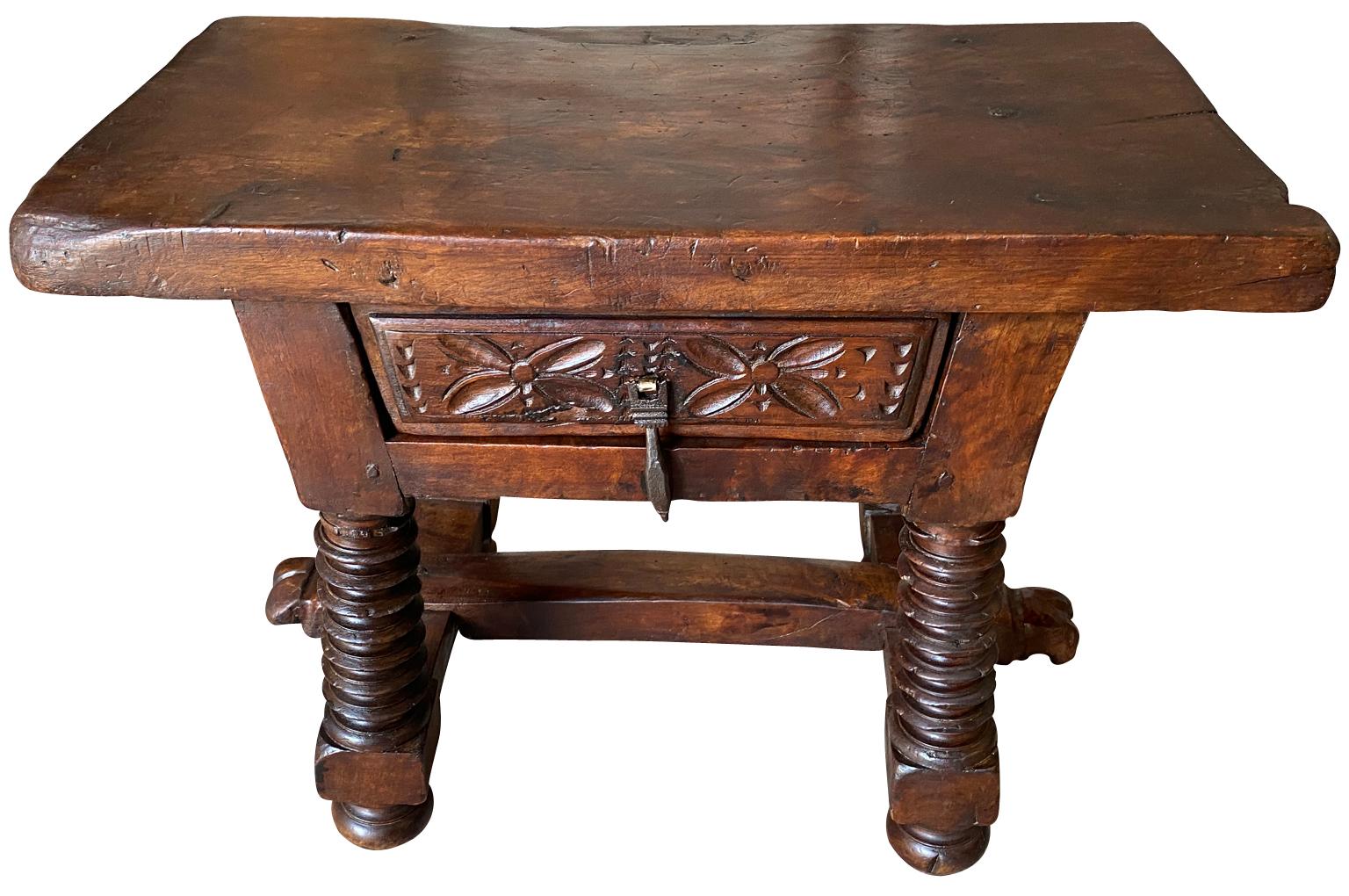 A very handsome early 19th century Arte Populaire side table from Northern Italy. Soundly constructed in beautiful walnut with a solid board top, a single drawer and turned legs. Stunning patina, warm and luminous.
