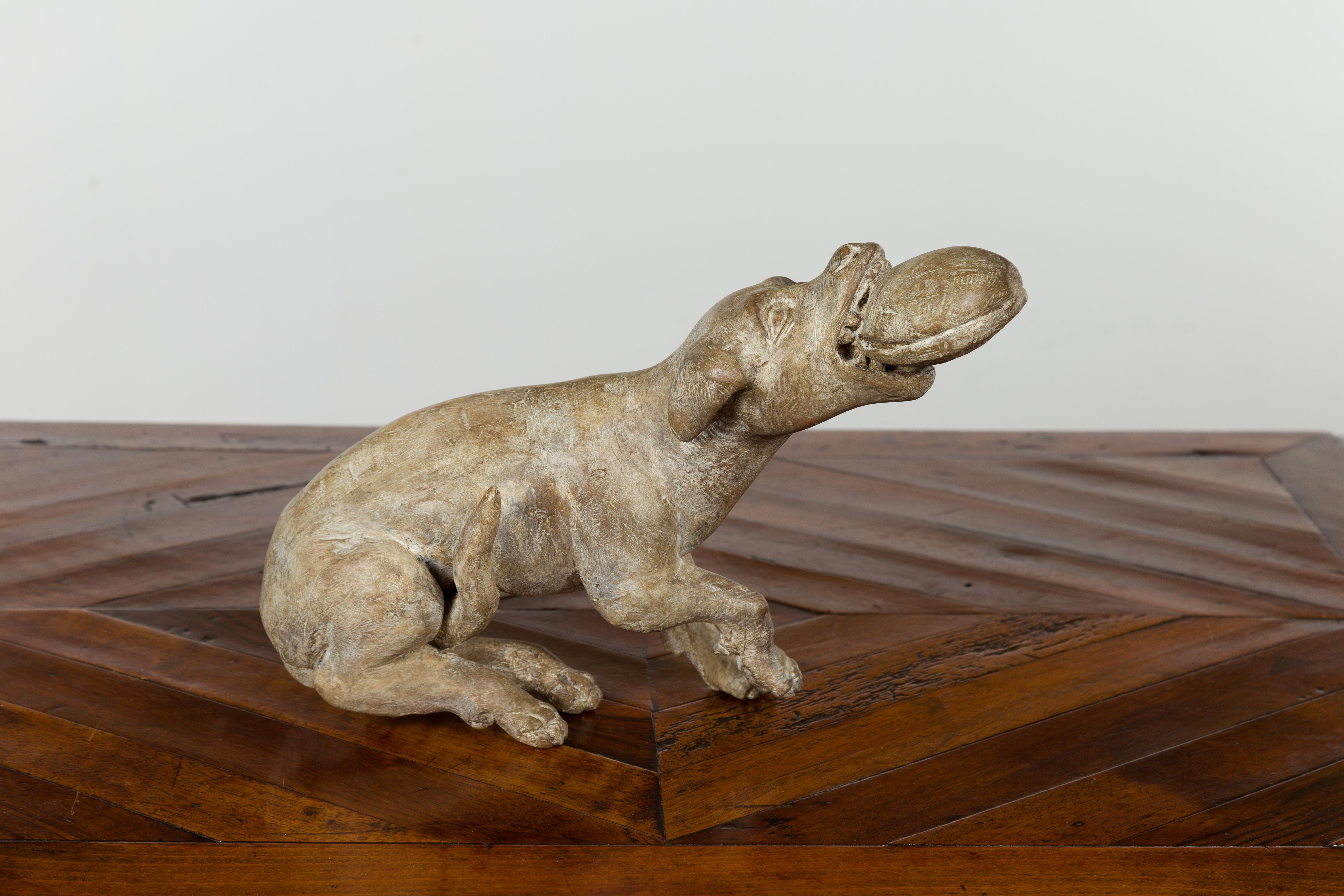 Italian Early 19th Century Carved Wooden Dog Playing with a Toy 1