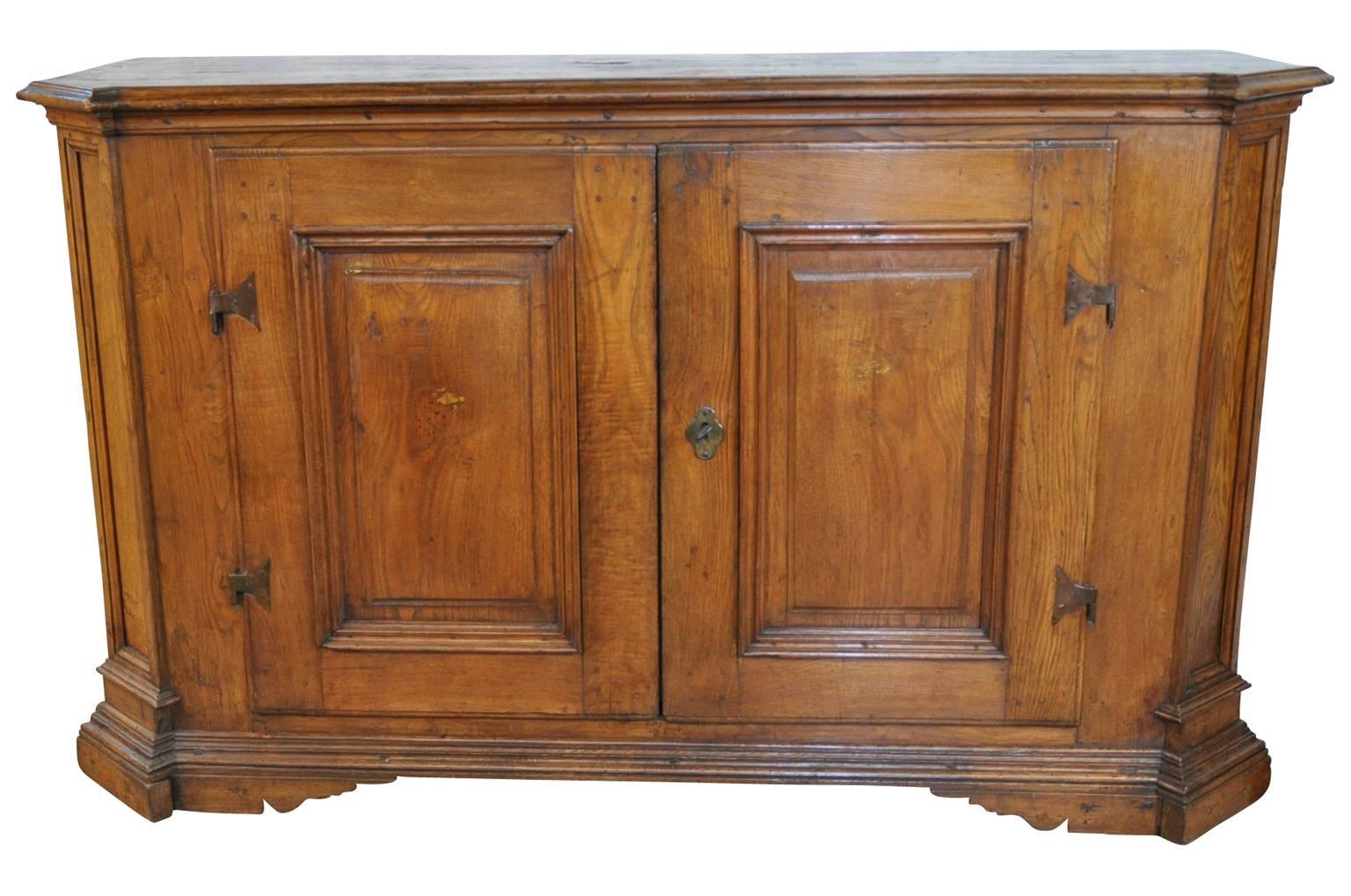 A fabulous early 19th century credenza from the Veneto region of Italy. Wonderfully constructed from chestnut - gorgeous patina. Double molded doors open to reveal a shelf and a long drawer.