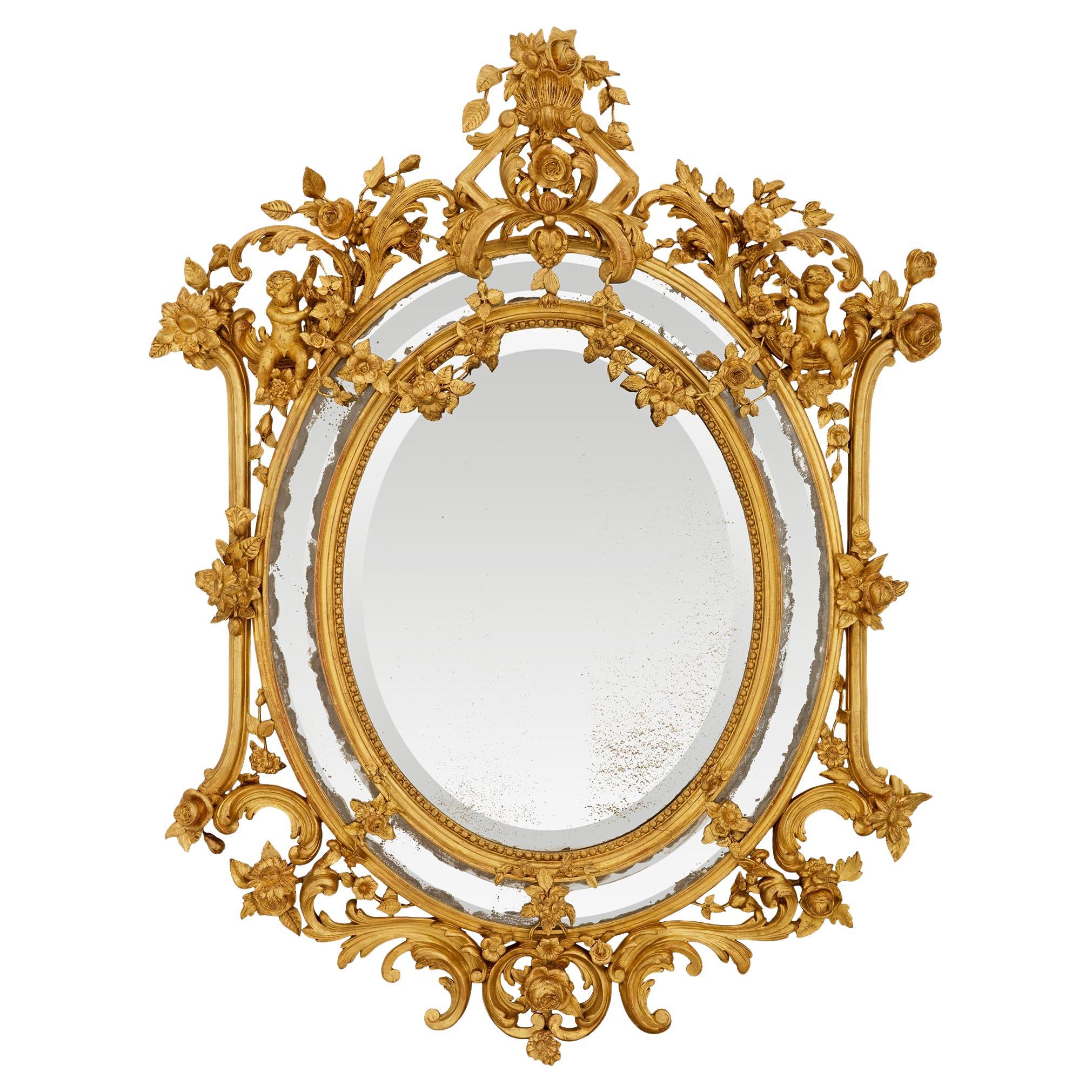 Miroir italien du début du 19ème siècle en bois doré de style Louis XV