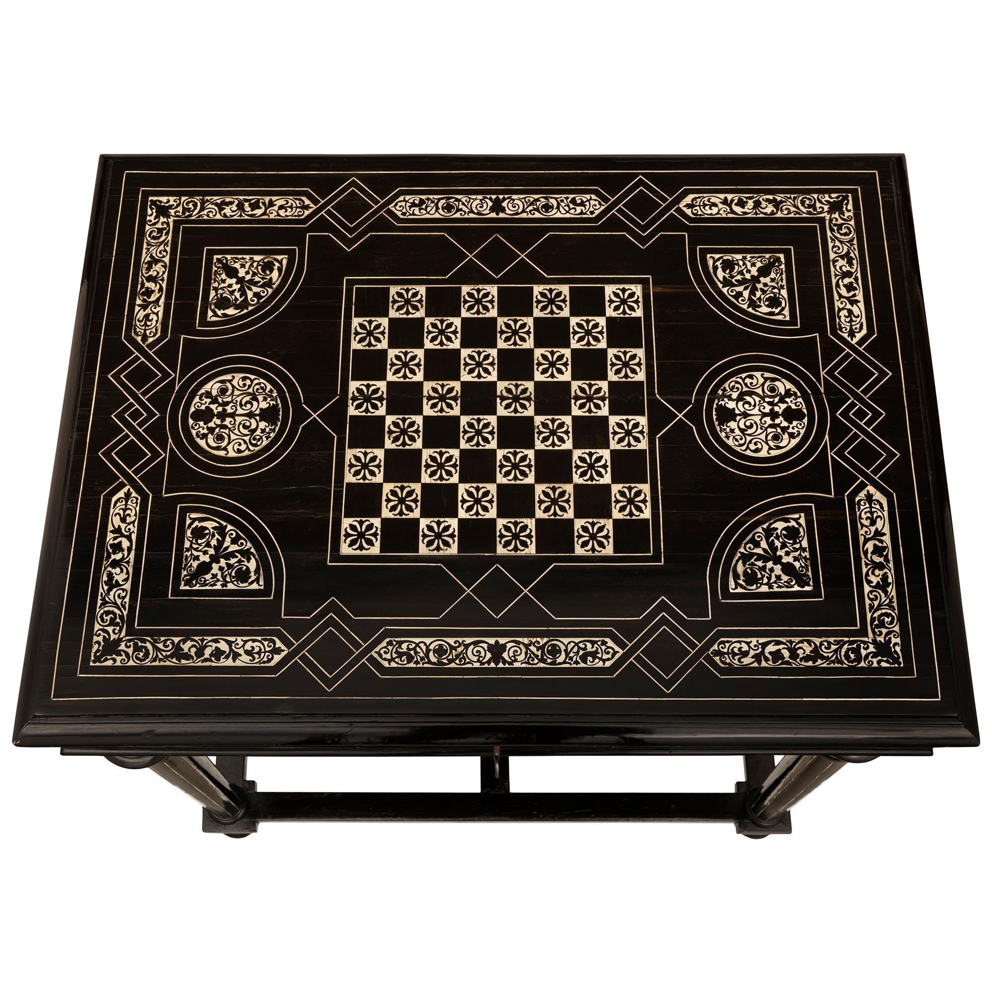 A very attractive Italian early 19th century Louis XVI st. ebony table. The table is raised by tapered legs with topie feet joined on each side by a straight stretcher which joined in the middle and centered by an inverted finial. The frieze has a