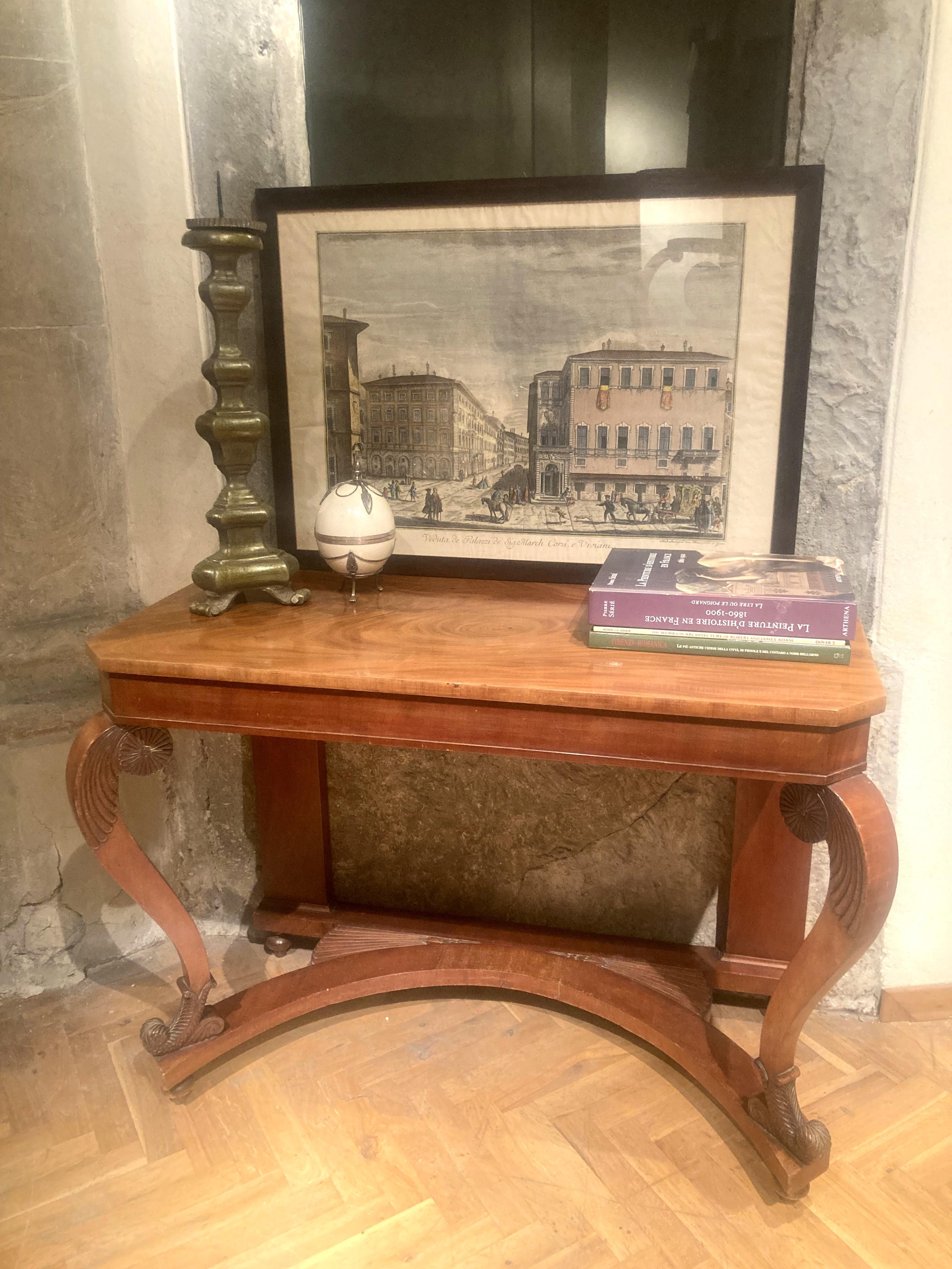 This Italian early 20th century cherrywood console table or writing desk is a fine Art Nouveau period piece of furniture. Its beautiful mellow honey colour and stylishly curved pillars supporting the wonderful chamfered edges tabletop will grace