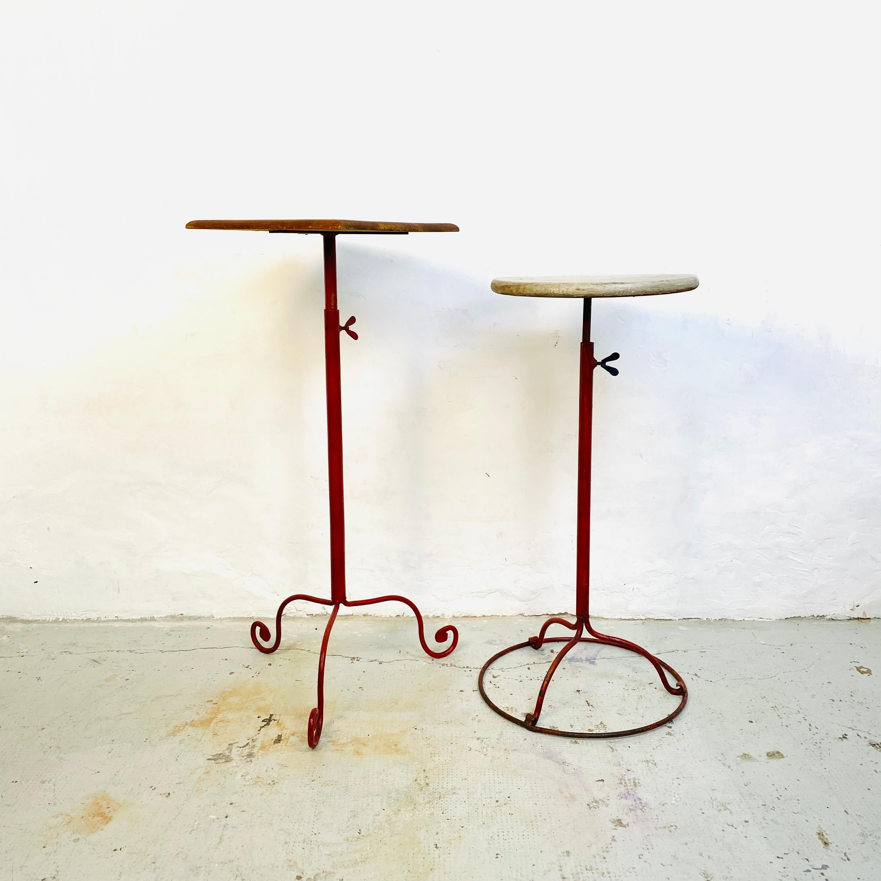 Italian early twentieth century Iron and solid wood pedestals, 1900s
Pair of pedestals with rectangular and round solid  wood shelves and structure in painted and worked wrought iron.
This are perfect for a sculpture, a plant vase or for a bathroom