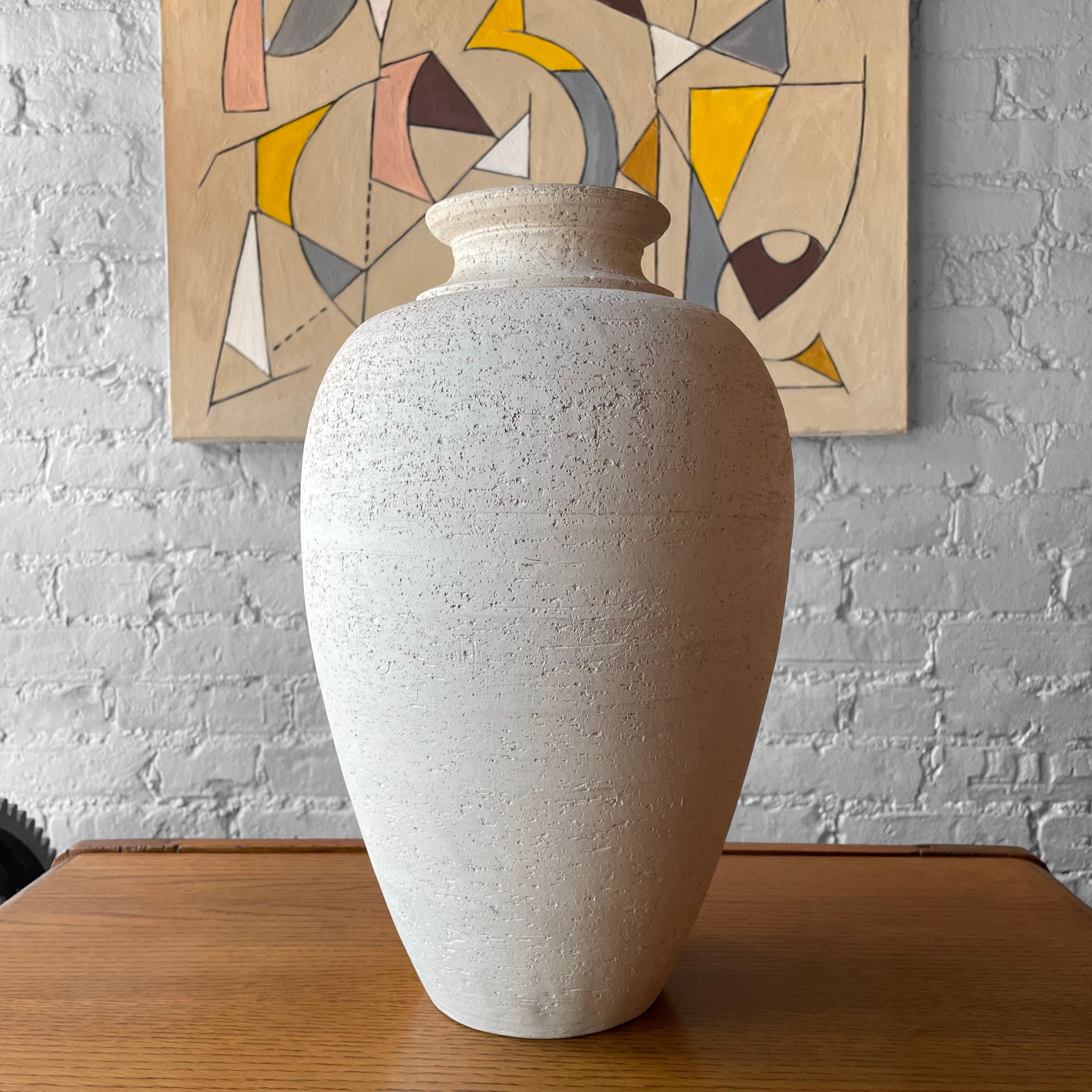 Large, Italian, mid-century, earthenware vase by Flavia Montepulo features a classical urn shaped form in a poruous, matte glaze with 3 inch mouth opening.