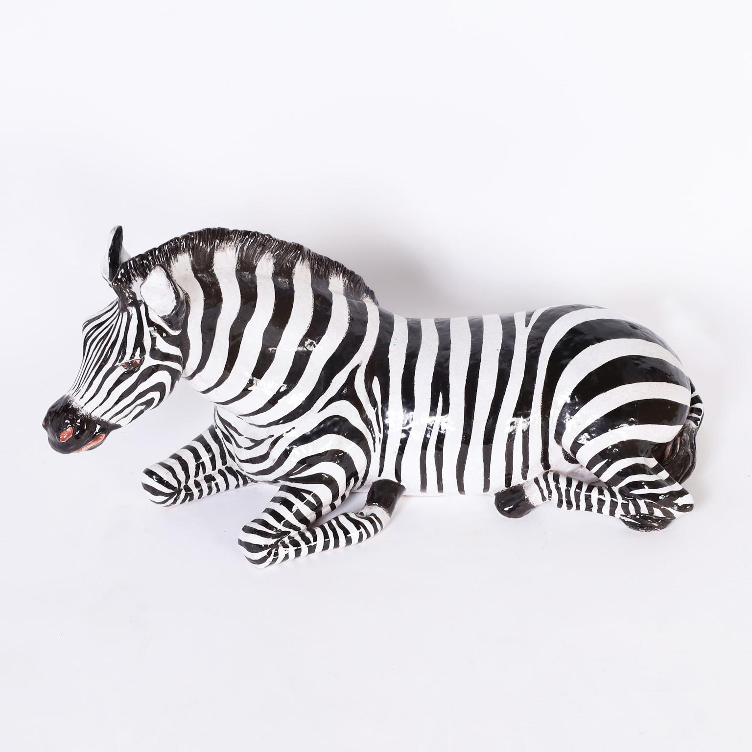 Mid century zebra sculpture crafted in terra cotta, decorated, glazed and forever in repose. Signed Italy on the bottom.